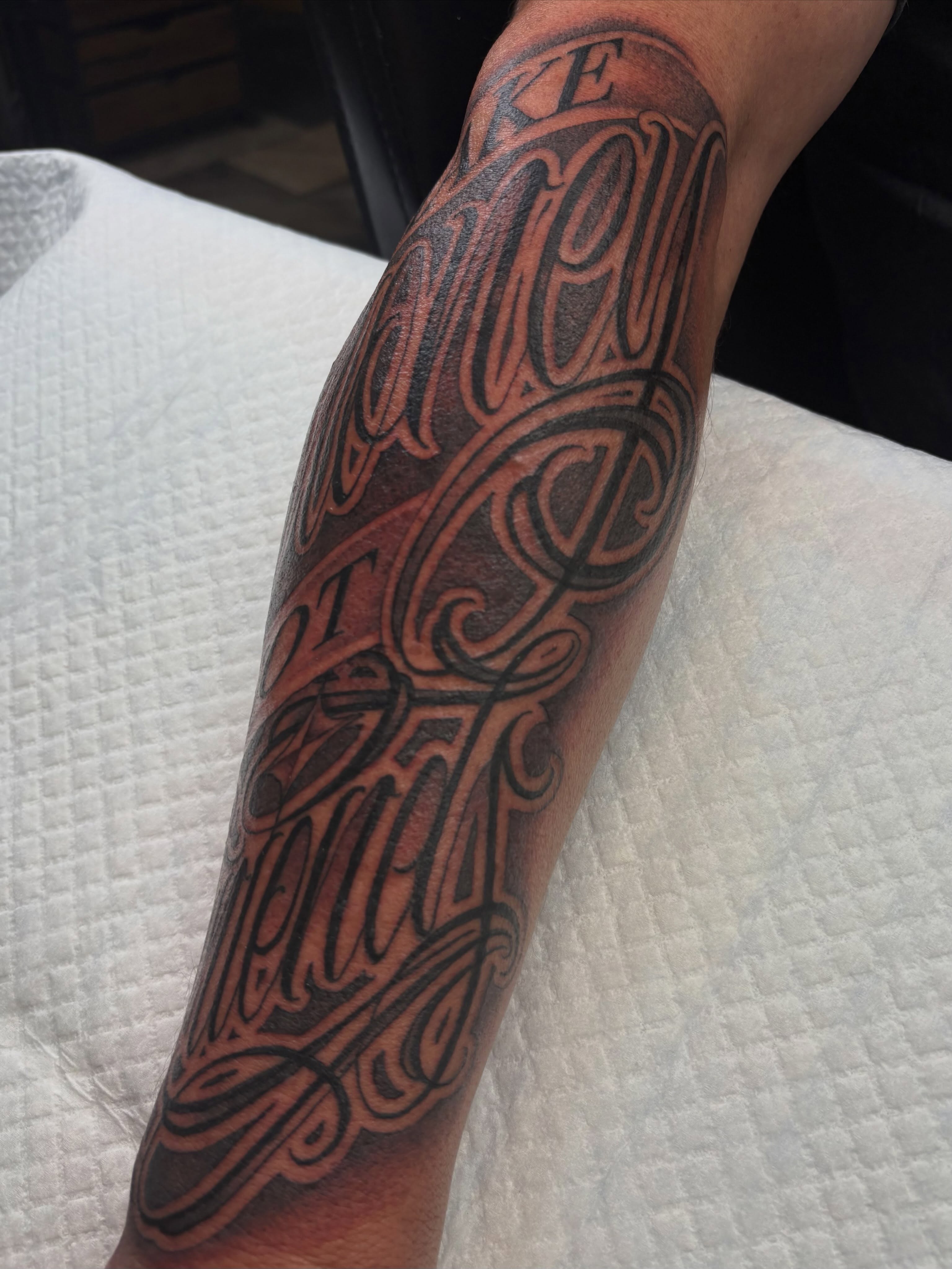 Script lettering lettering script tattoo on the forearm by Trusty Dizon Tattoo Artist