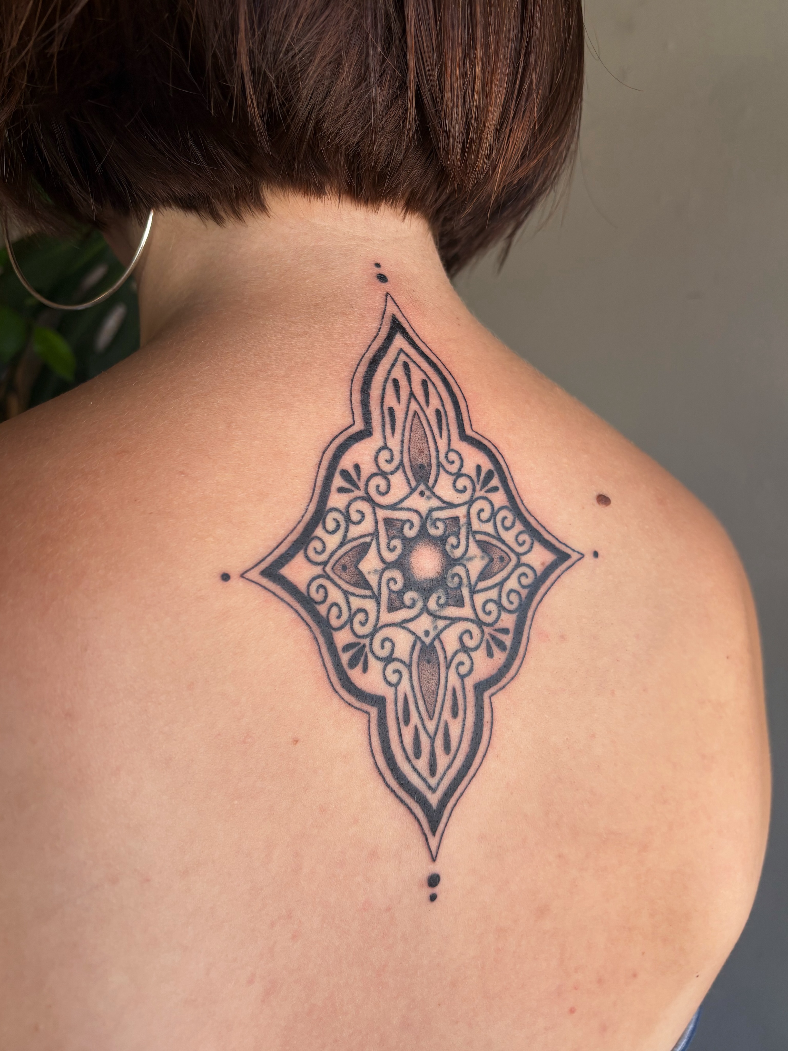 Geometric mandala geometric tattoo on the back by Abigail, San Francisco, California