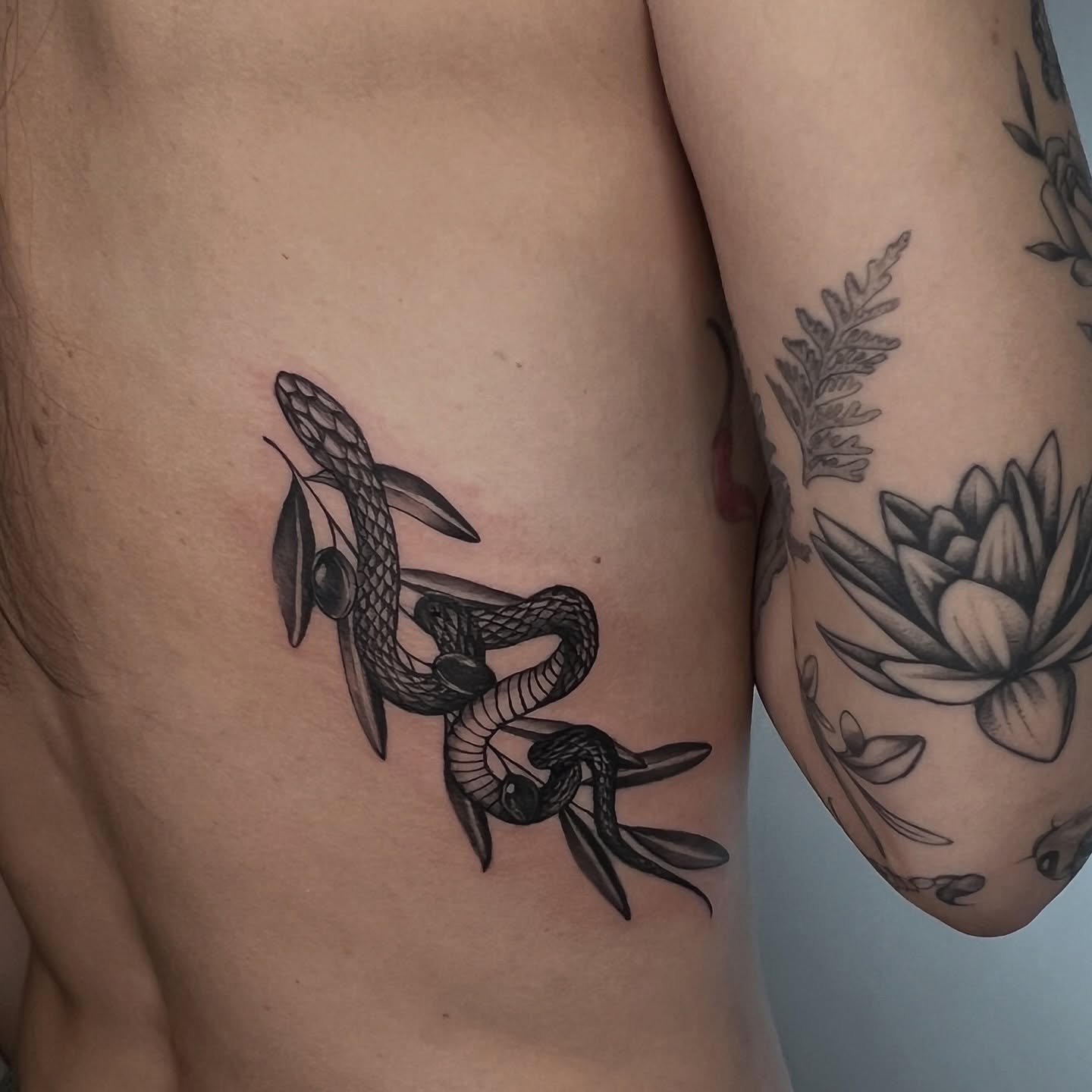Snake and lotus realism tattoo on the thigh by ⚒dptattoos ⚒, East Williamsburg, Brooklyn