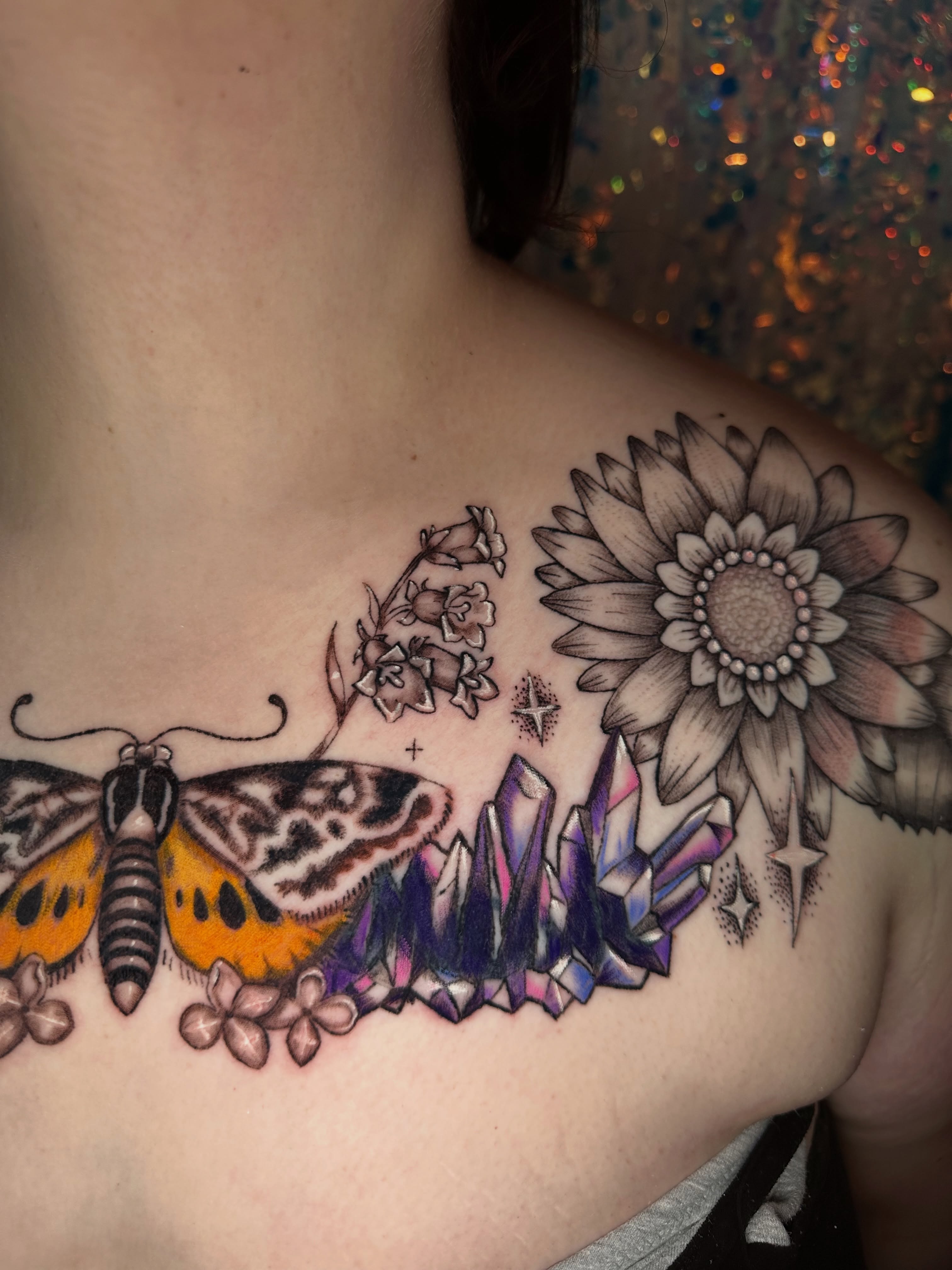 Butterfly, flowers, sunflower, crystals realism tattoo on the shoulder by Sunny, Austin, Texas