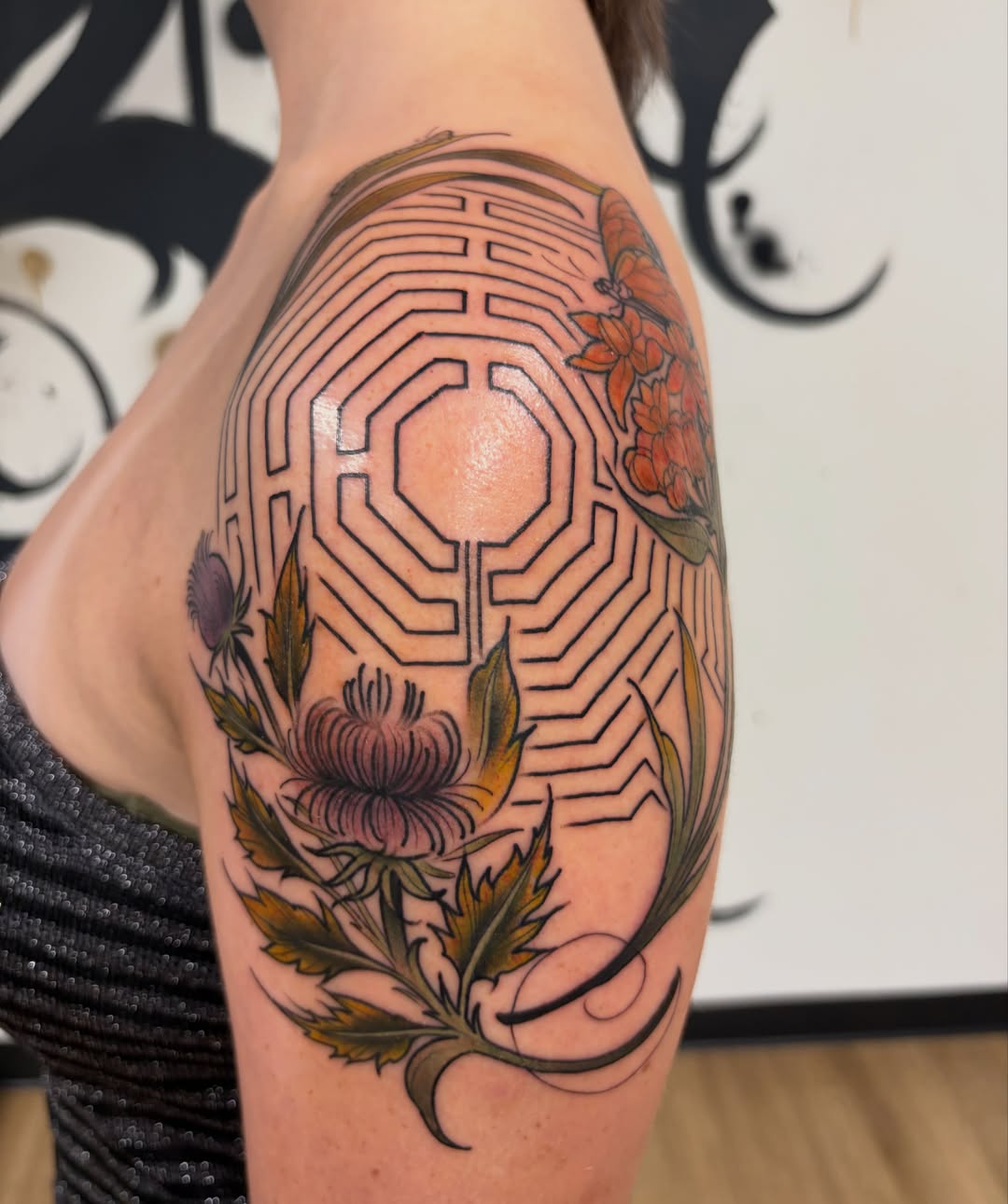 Maze and floral geometric tattoo on the upper arm by Kayla Fay, Baton Rouge, Louisiana
