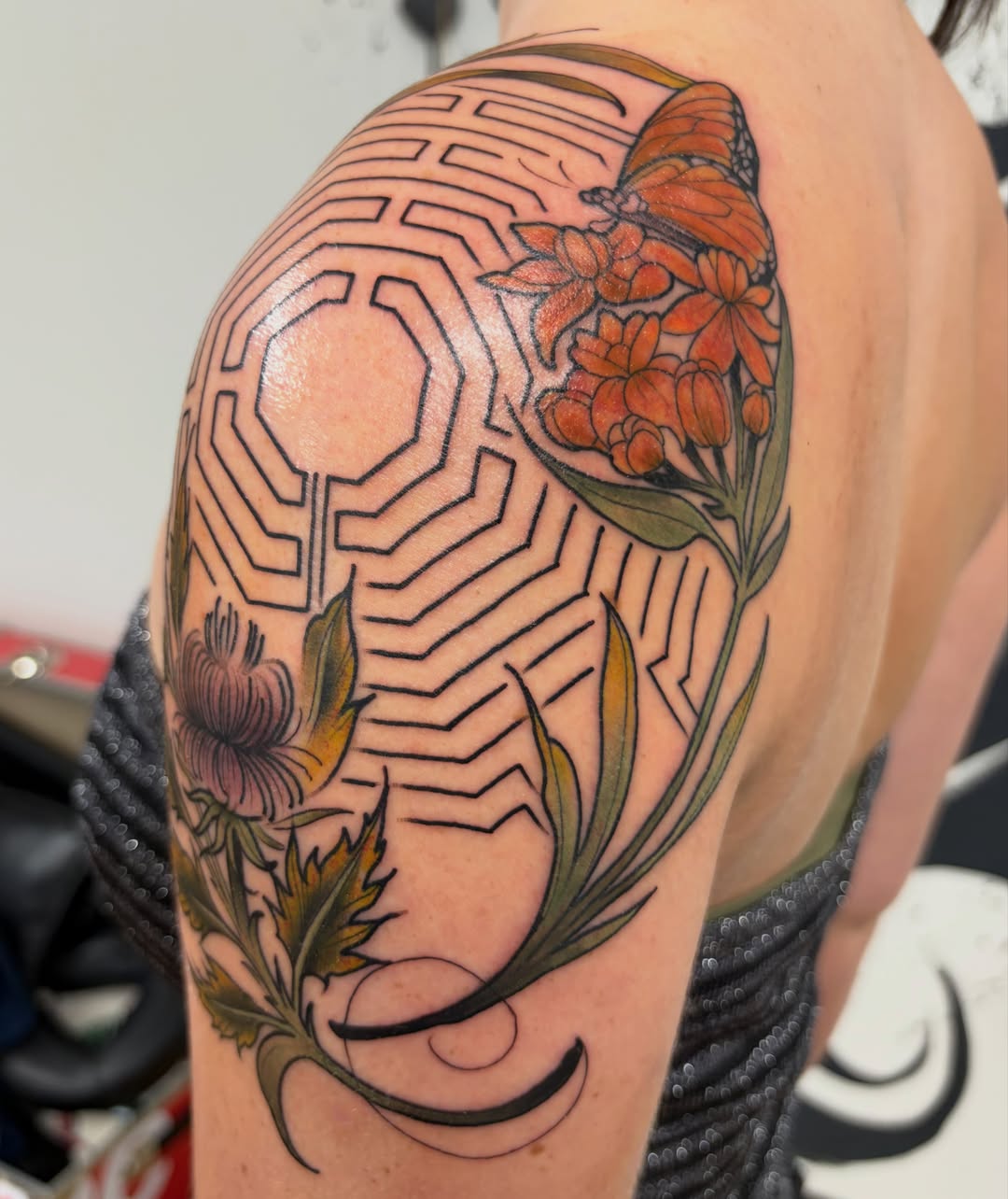 Geometric maze with flowers geometric tattoo on the shoulder by Kayla Fay, Baton Rouge, Louisiana