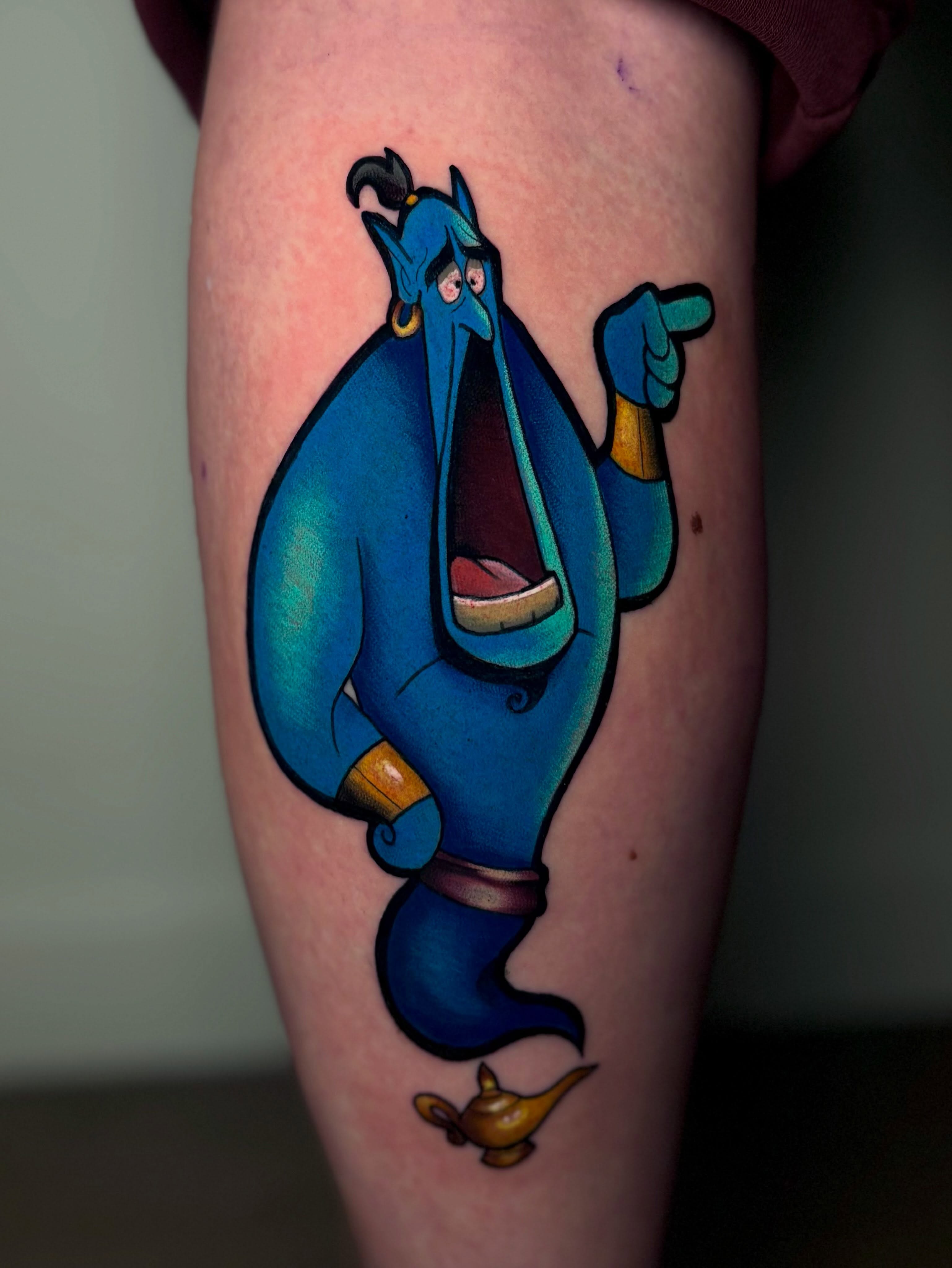 Genie from Aladdin new school tattoo on the thigh by Jess
