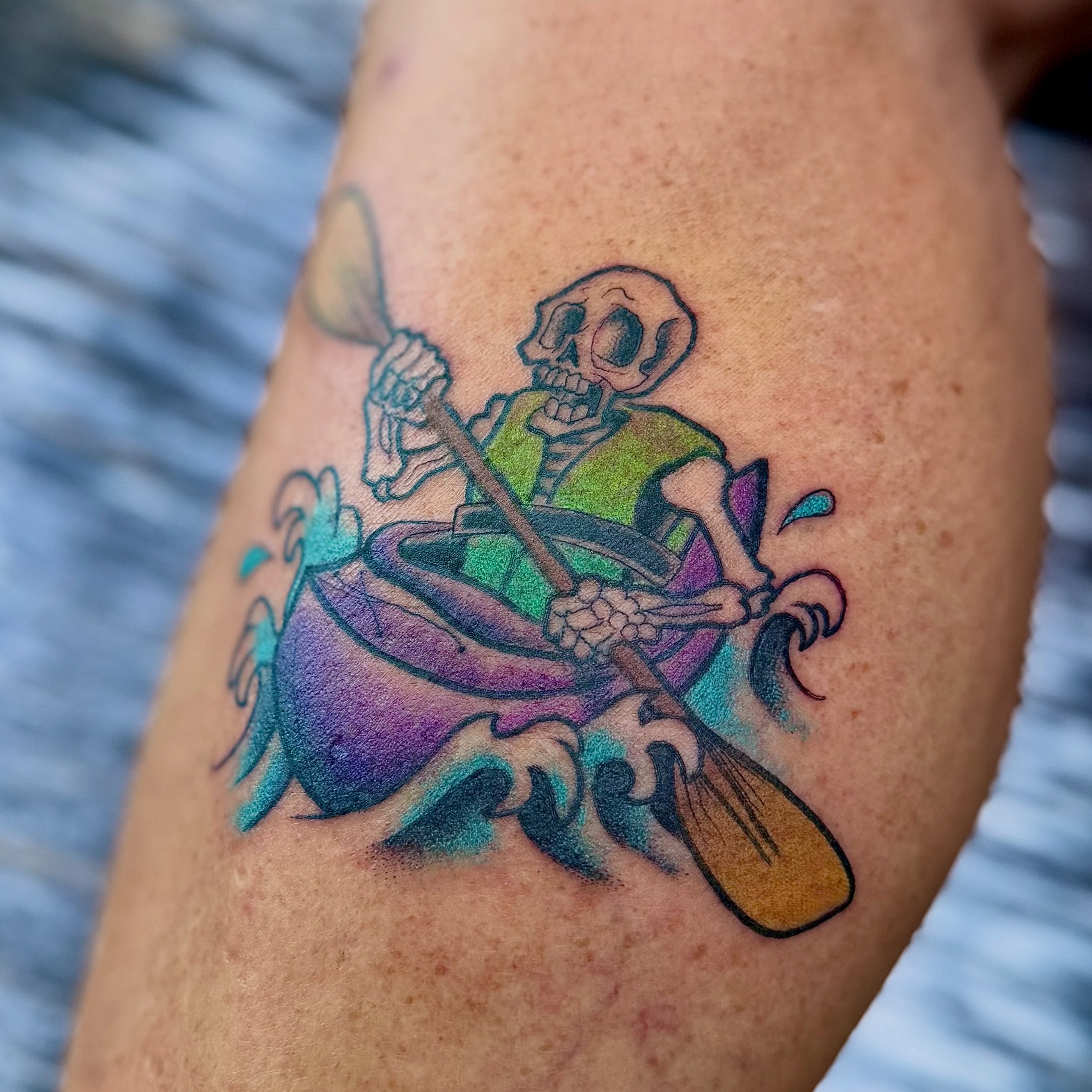 Skeleton rowing new school tattoo on the forearm by Jamie Hall, Kansas City, Missouri