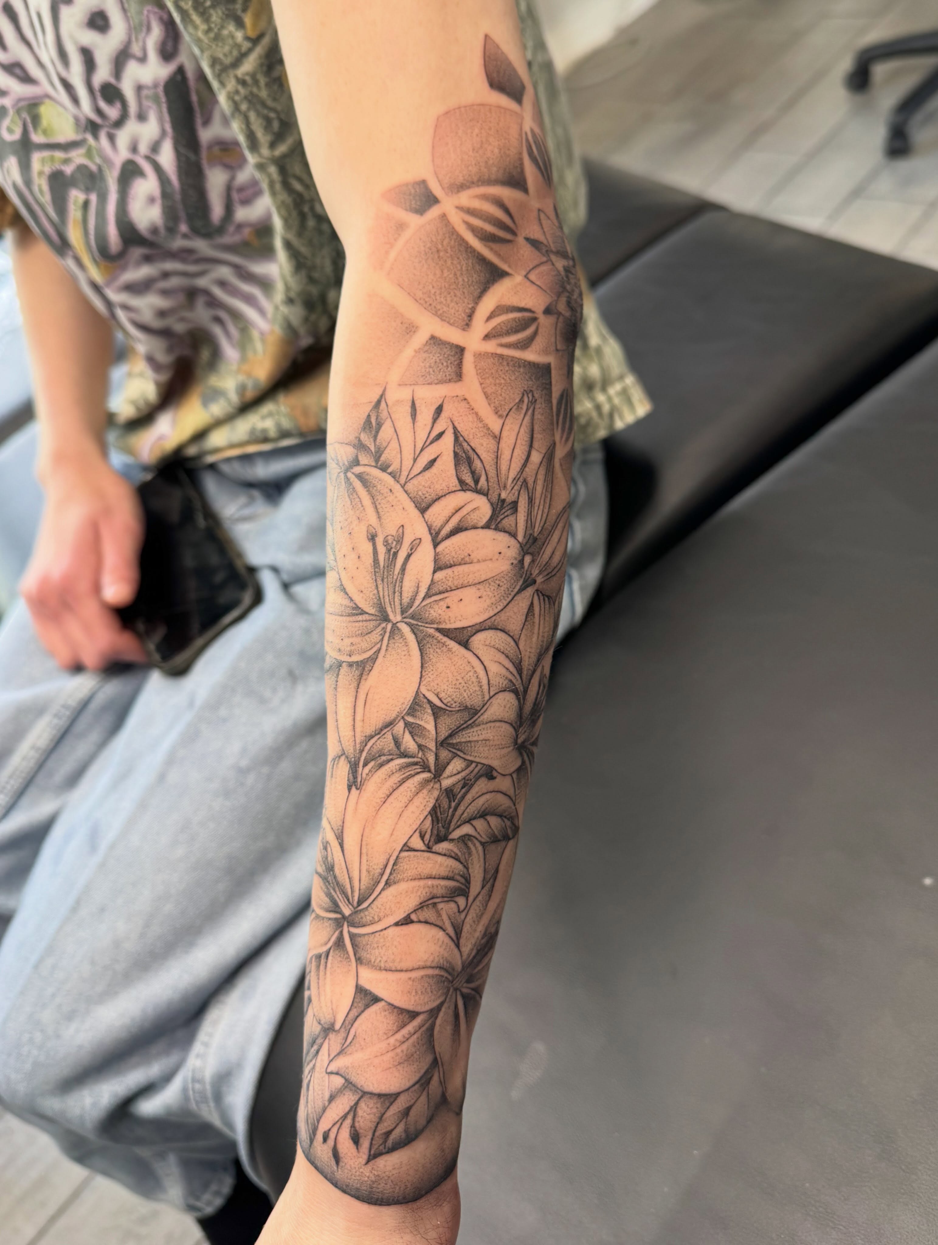 Floral arrangement dotwork tattoo on the forearm by Joey Flaherty