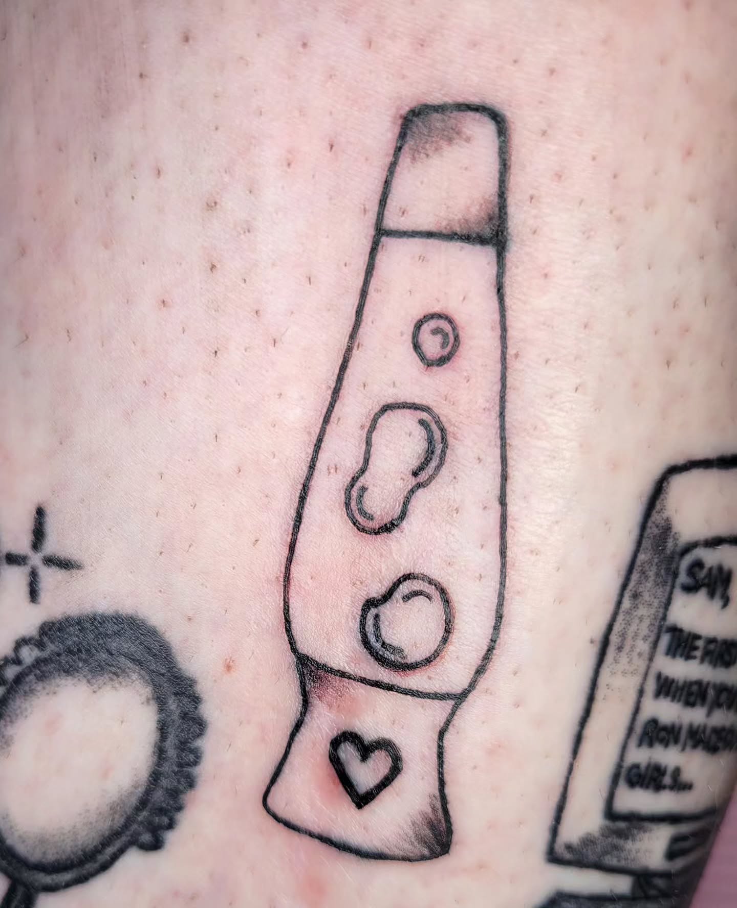 Lava lamp minimalist tattoo on the forearm by Peach & Poke, Lethbridge, Alberta
