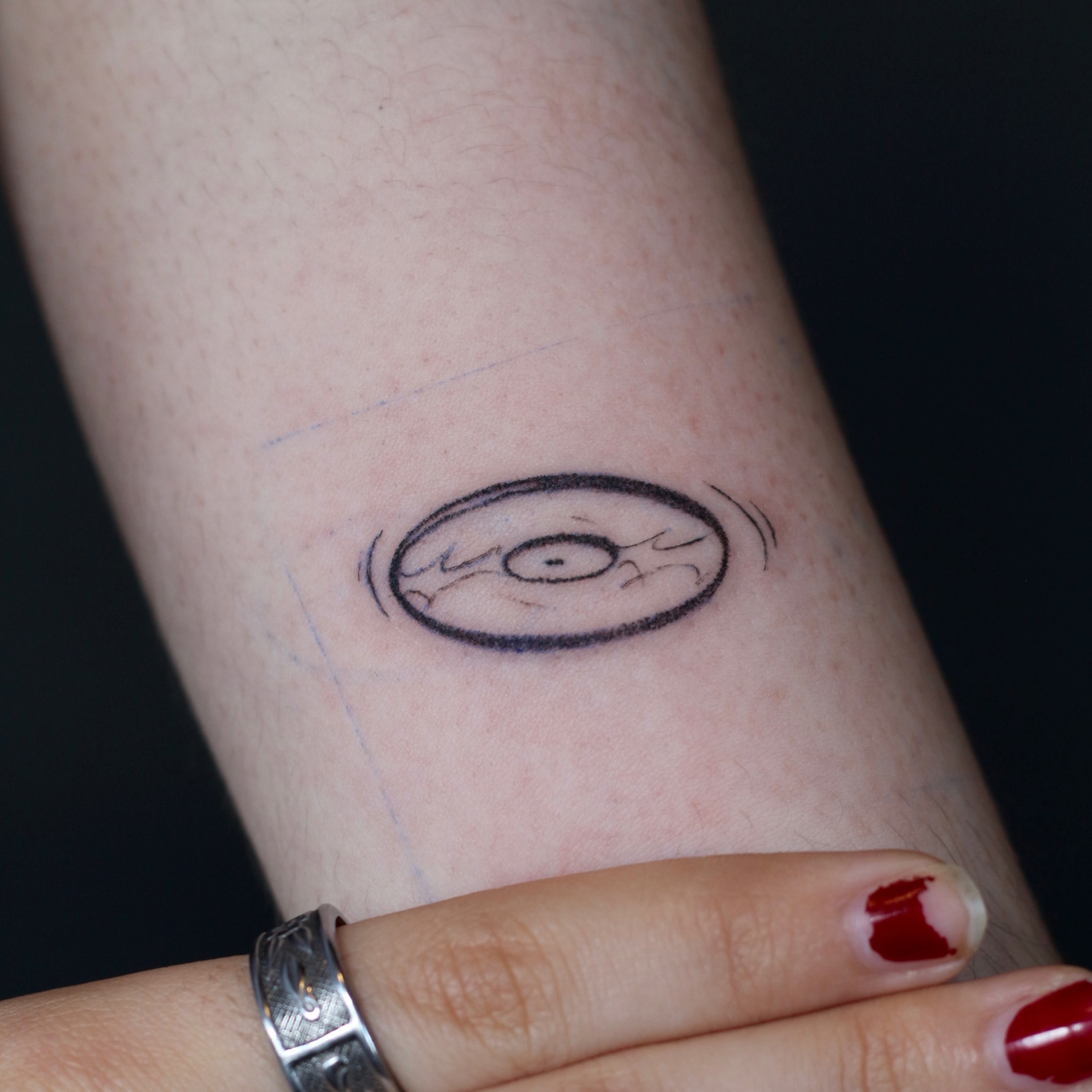 Eye geometric tattoo on the forearm by Stephany Victorine