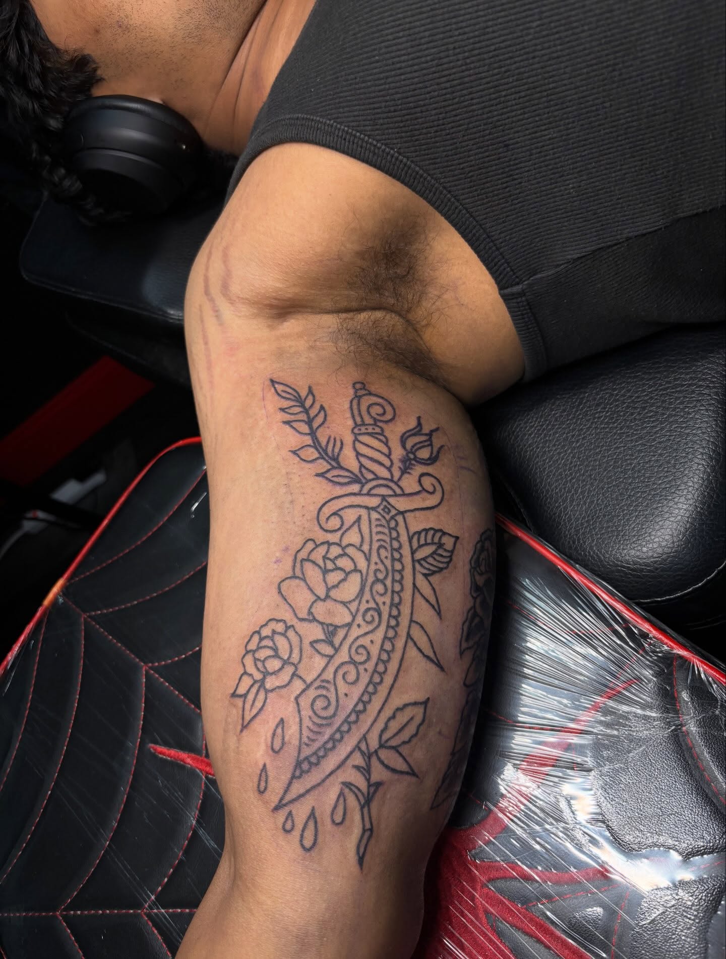 Knife and floral ornamental tattoo on the forearm by Ethan Ellis, Dallas, Texas