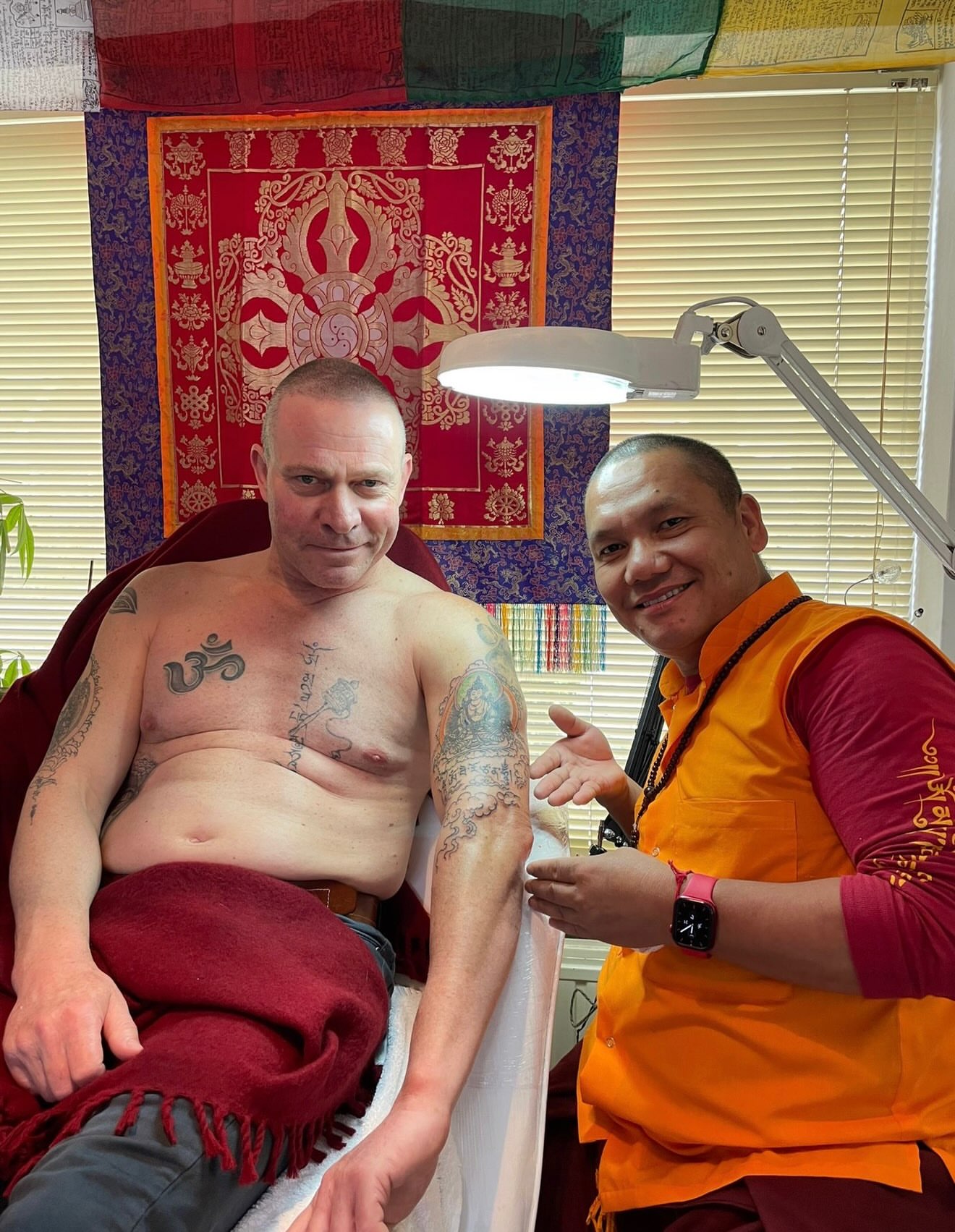 Om symbol and script American traditional tattoo on the chest by Lama *Tashi *Norbu, Emmen, Drenthe