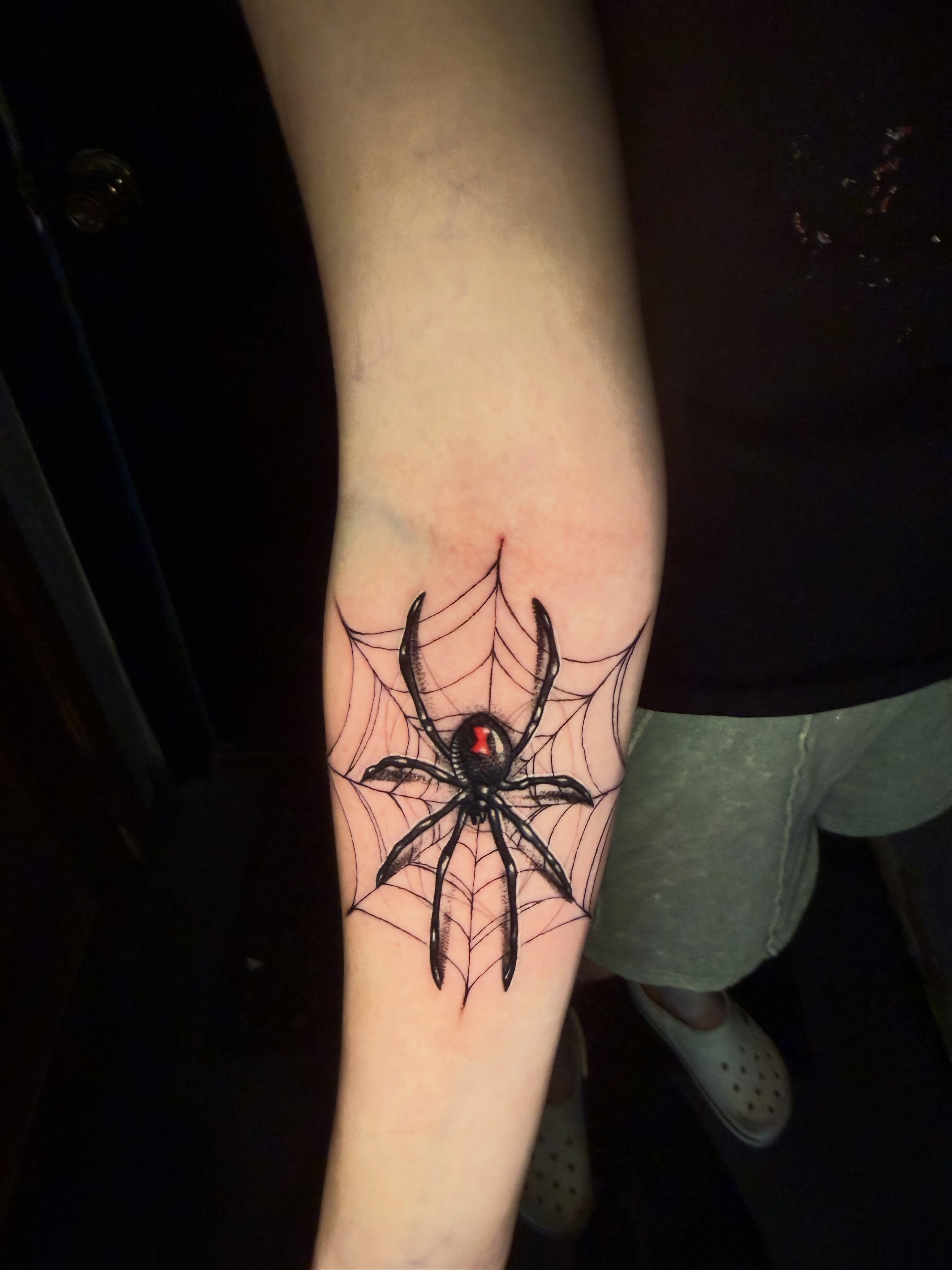 Spider blackwork tattoo on the forearm by Alex Wheelock