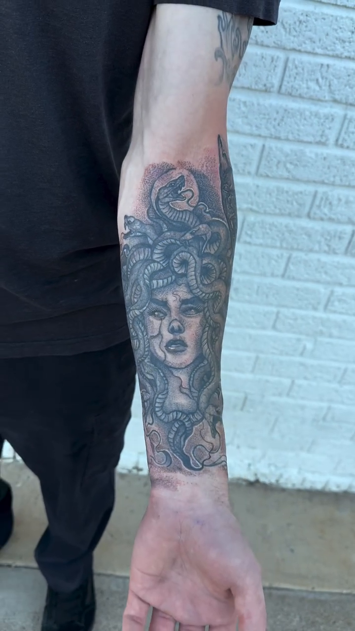 Medusa and a wolf realism tattoo by Alex Wheelock