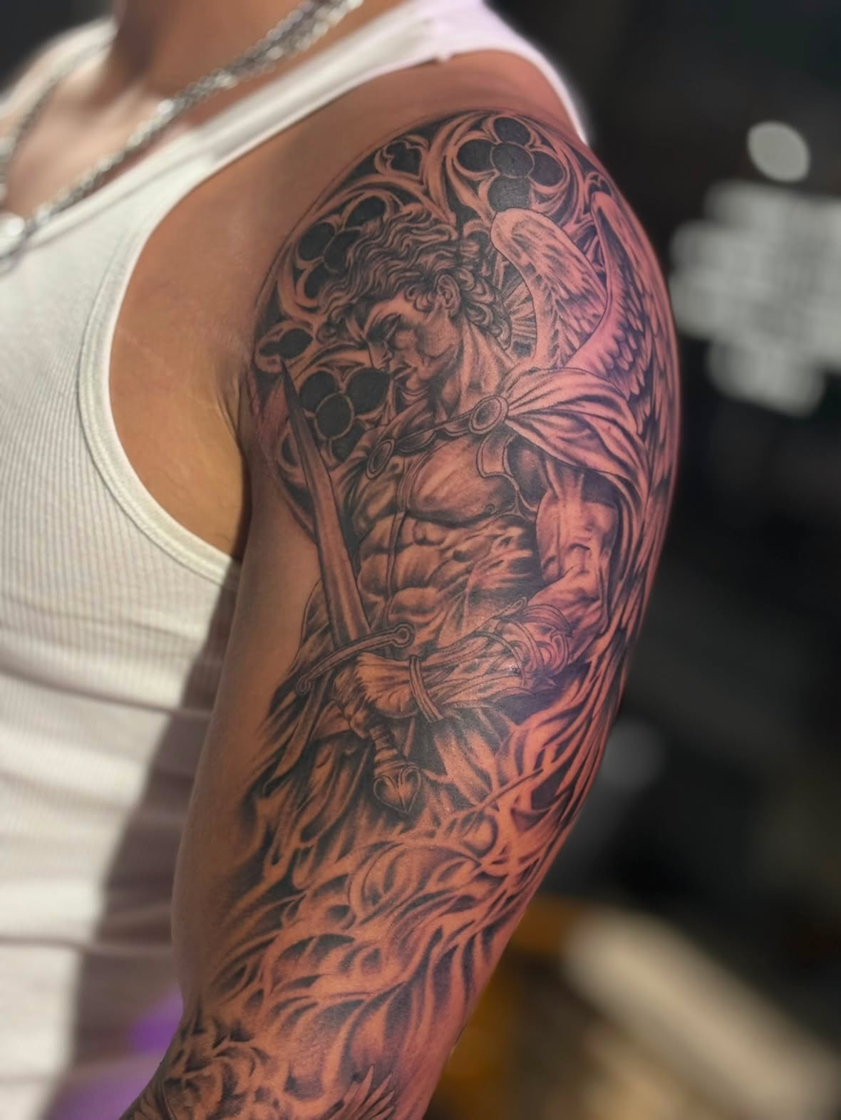 Angelic warrior realism tattoo on the upper arm by Kevin