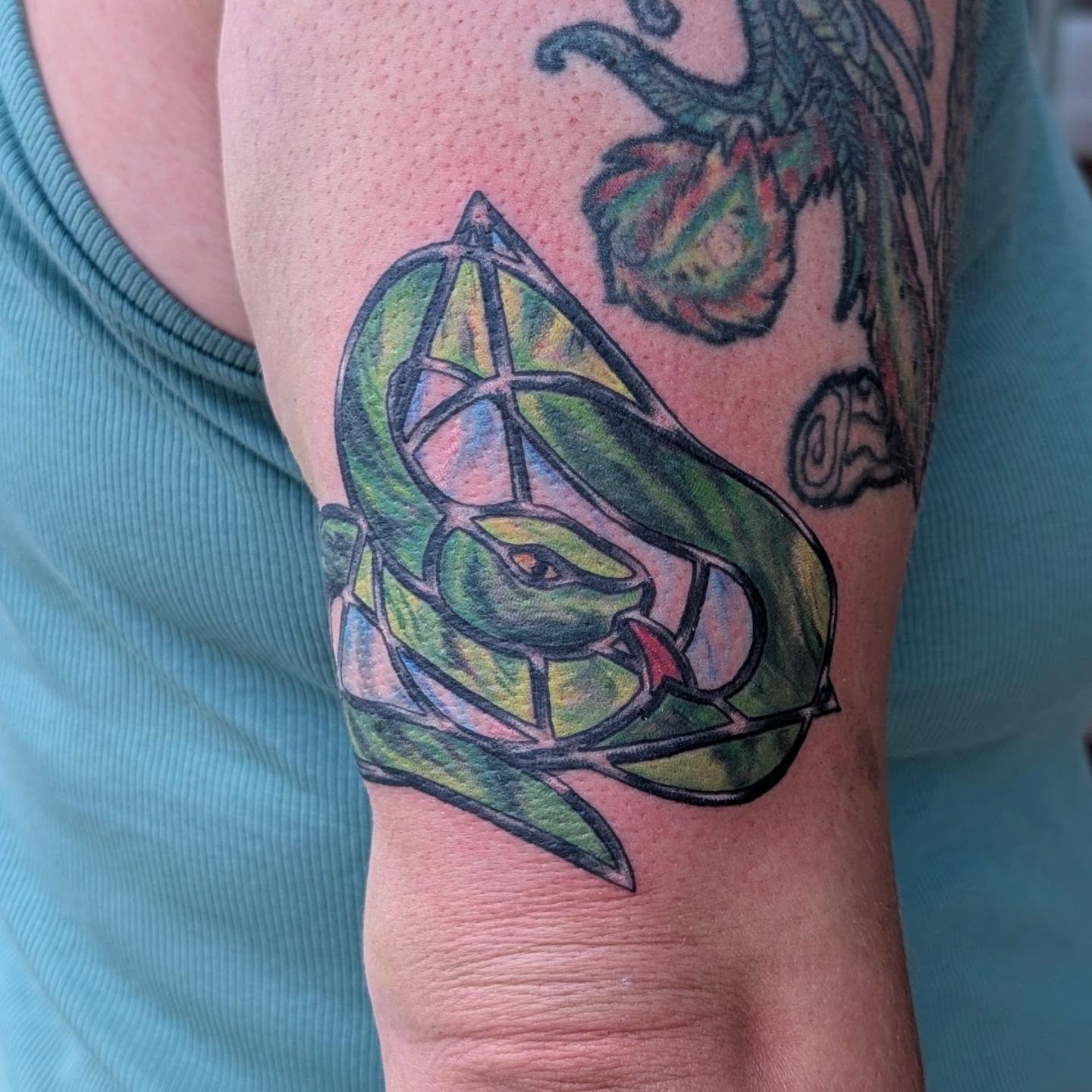 Stained glass snake geometric tattoo on the forearm by Hannah Hayes, Livonia, Michigan