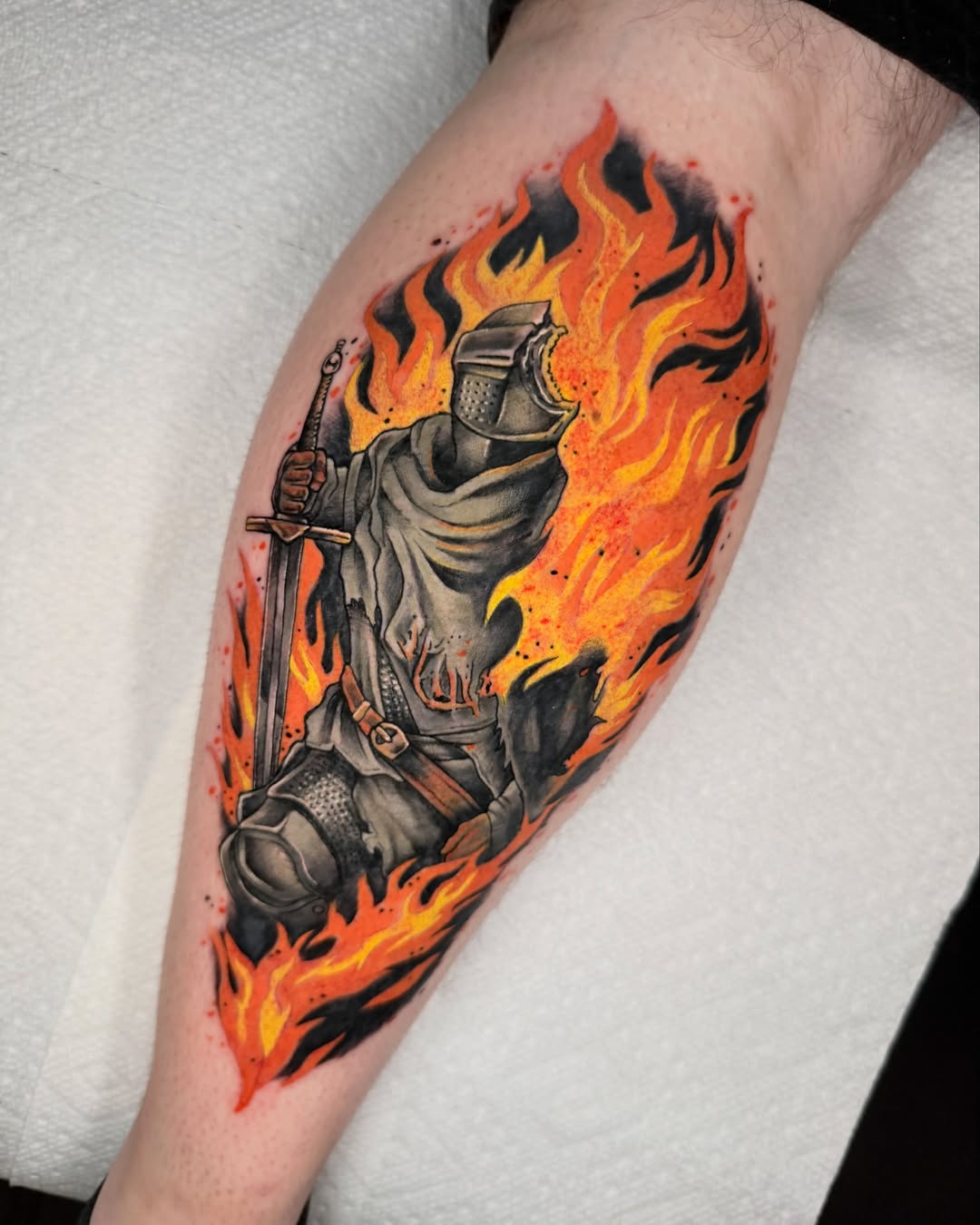 Flaming knight realism tattoo on the forearm by Rigo4k
