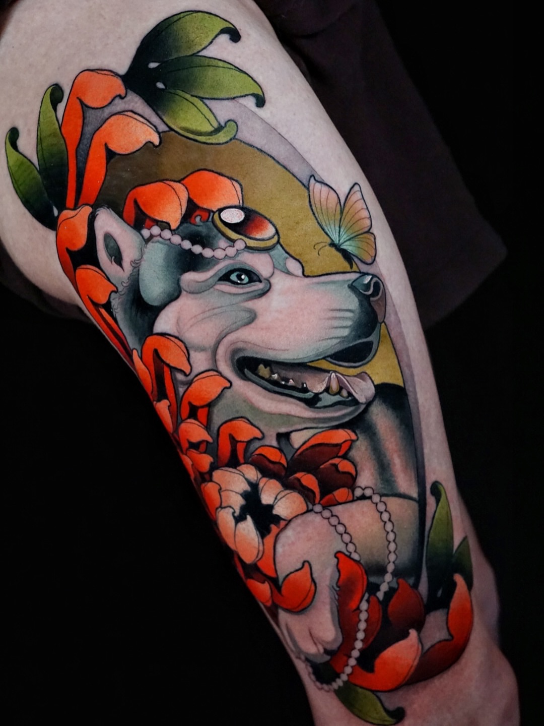 Dog with flowers American traditional tattoo on the forearm by Skyler Miller