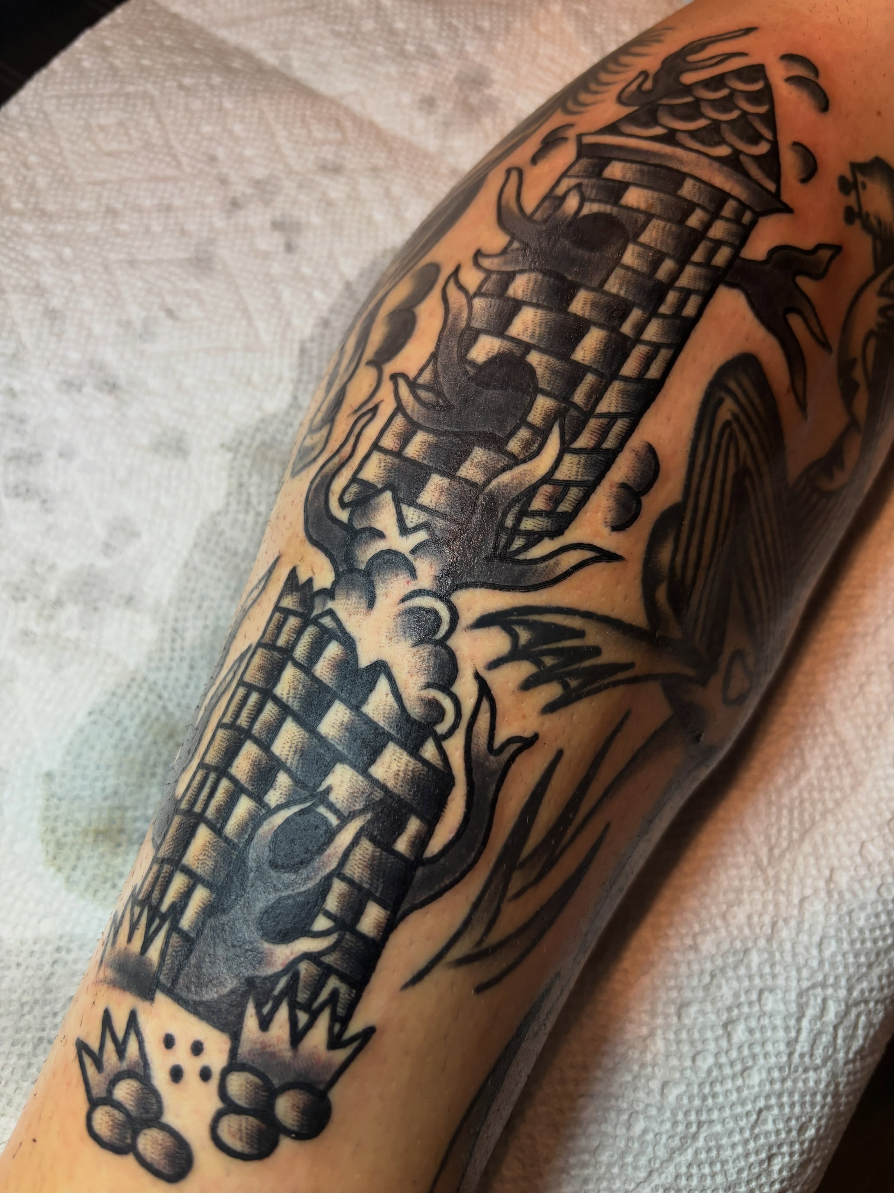 Skull and dragon American traditional tattoo on the forearm by Mitch Ashpaugh