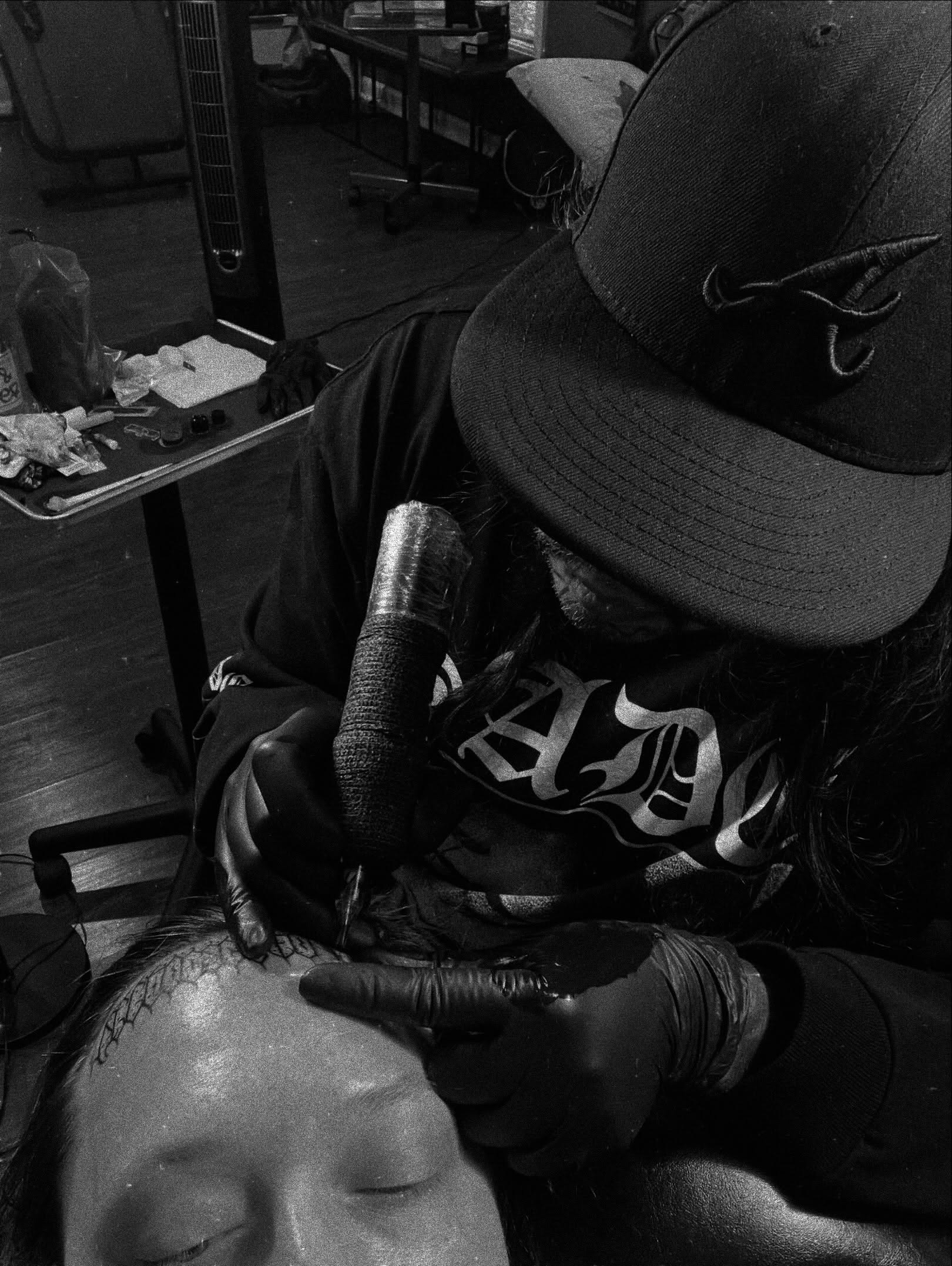 Headpiece black and grey tattoo on the head by Tattoo Kayla
