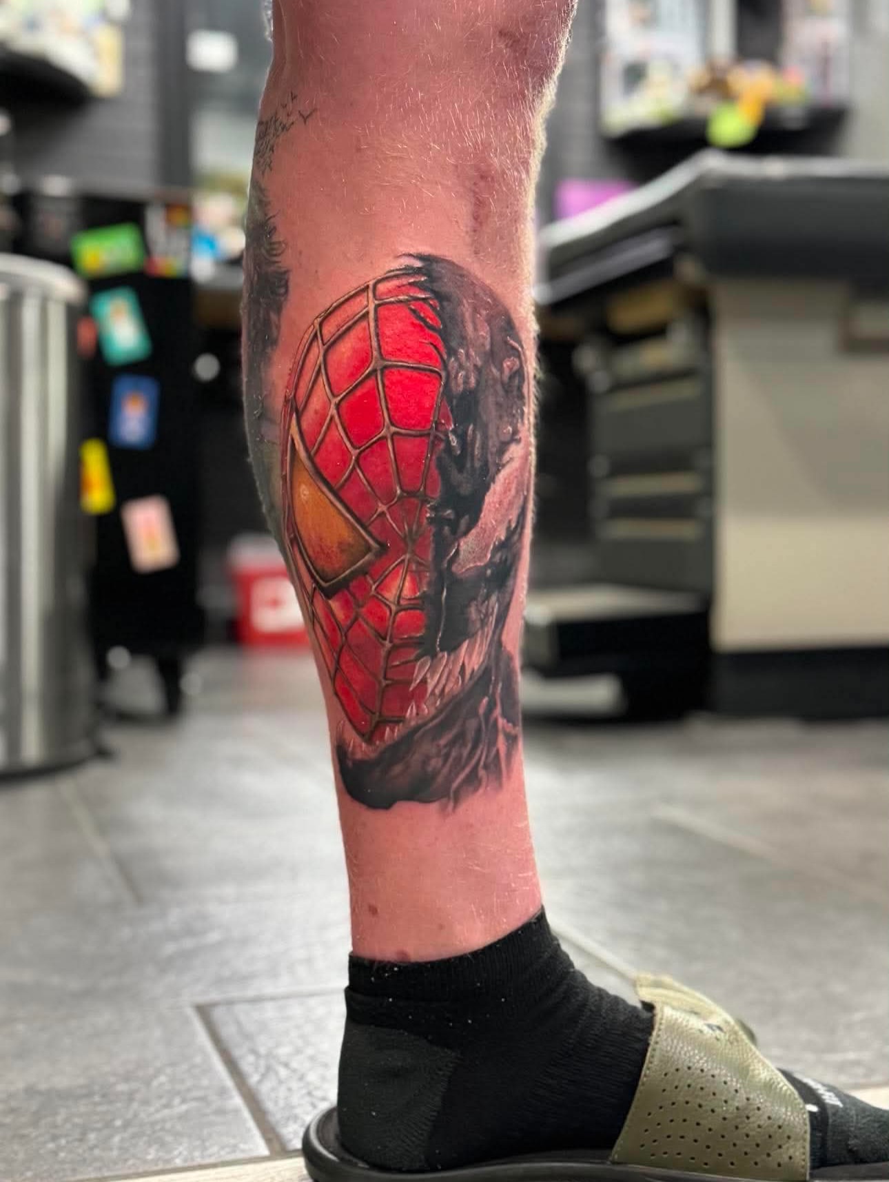 Spiderman mask realism tattoo on the forearm by Kyle J. Bishop