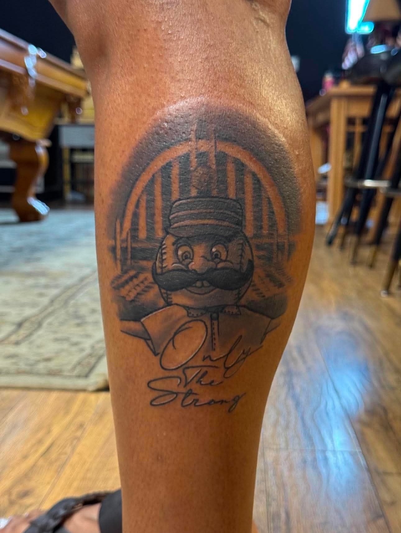 Nutcracker black and grey tattoo on the forearm by Kyle J. Bishop