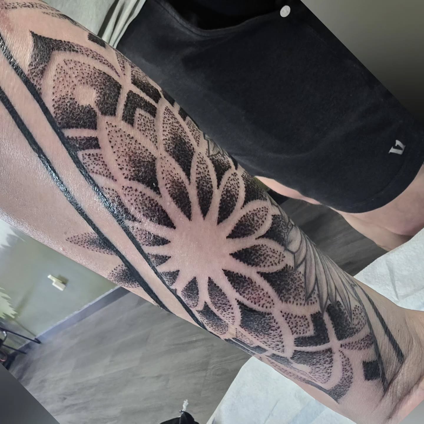 Geometric pattern dotwork tattoo on the forearm by bonnie