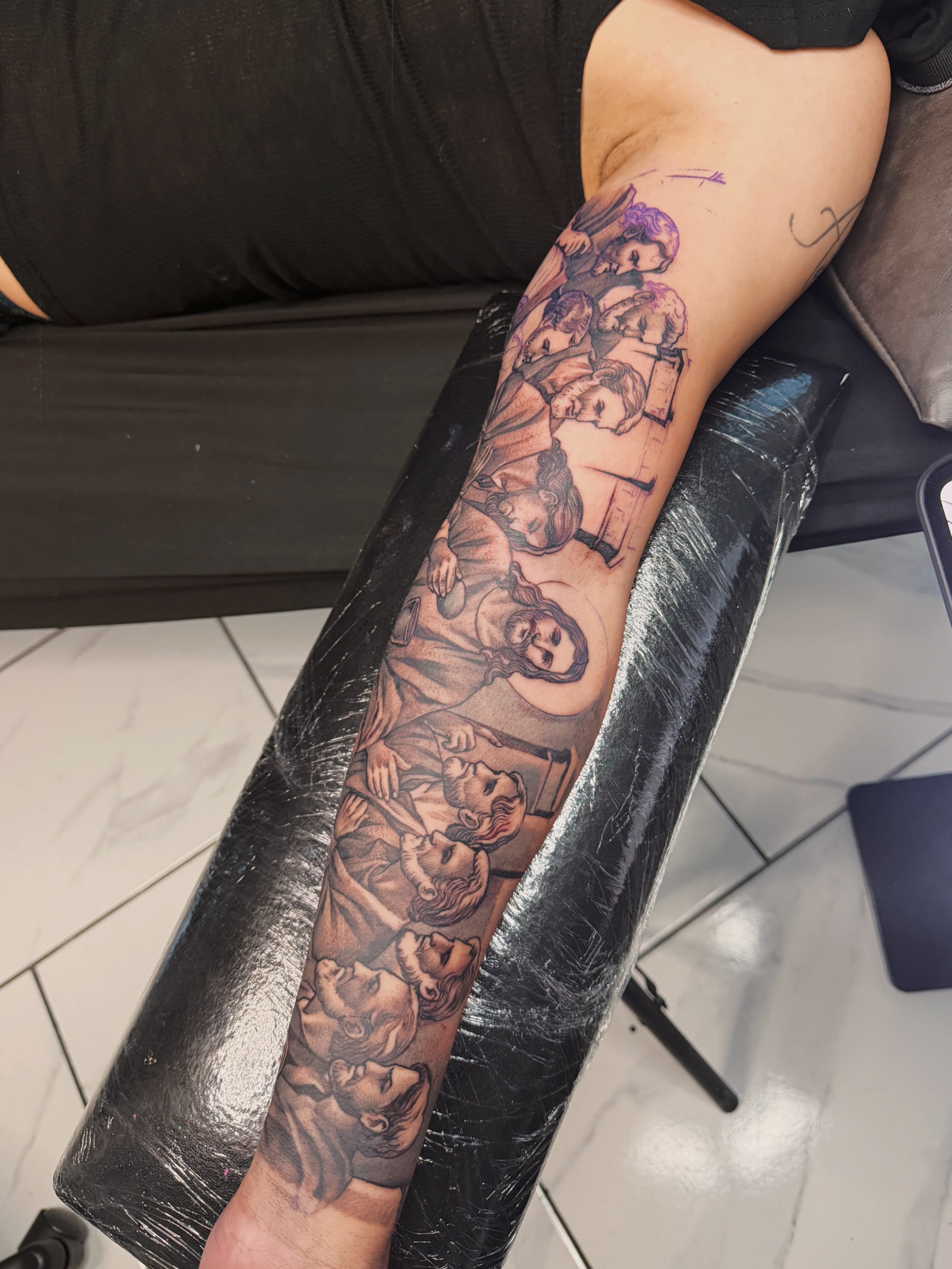 Religious group black and grey tattoo on the forearm by Adrian gonzalez...