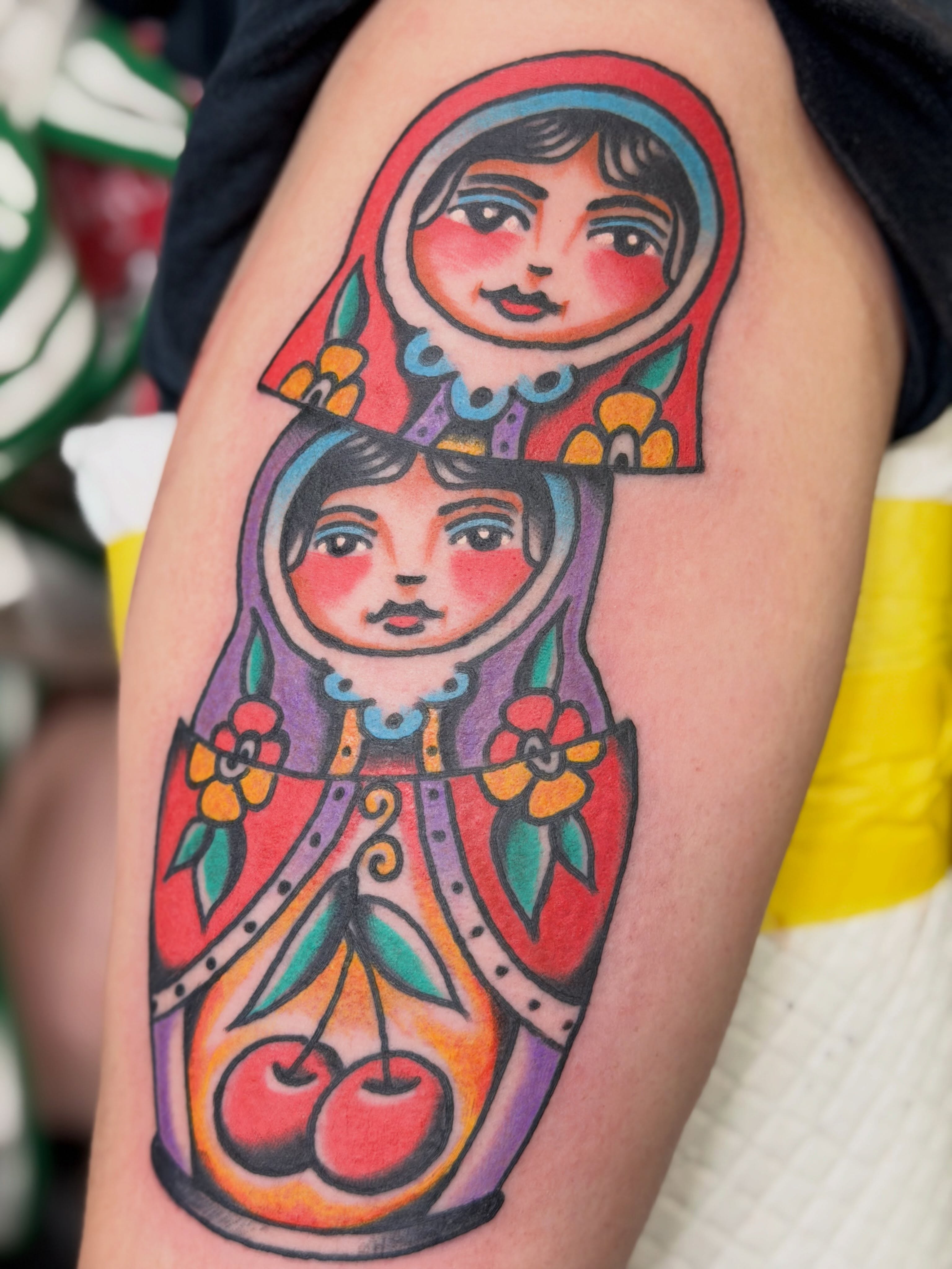 Matryoshka doll American traditional tattoo on the thigh by dave rash