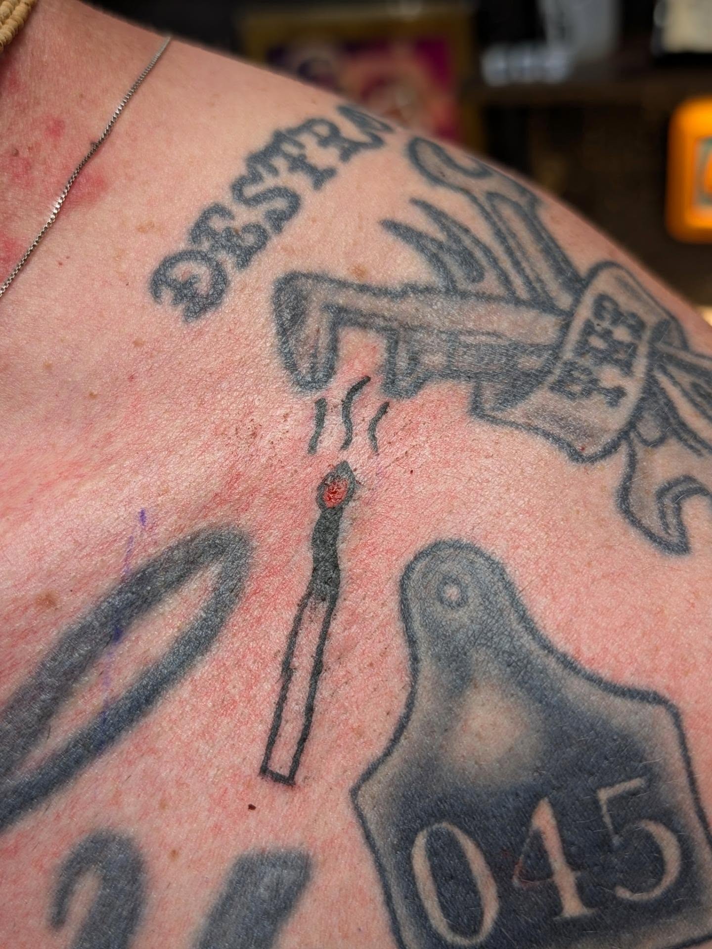 Matchstick black and grey tattoo on the shoulder by Jon Sedor