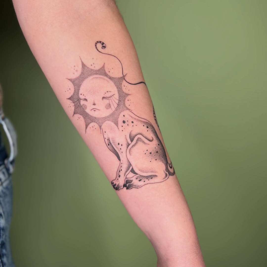 Cat and sun dotwork tattoo on the forearm by 𝔇𝔢𝔰𝔦