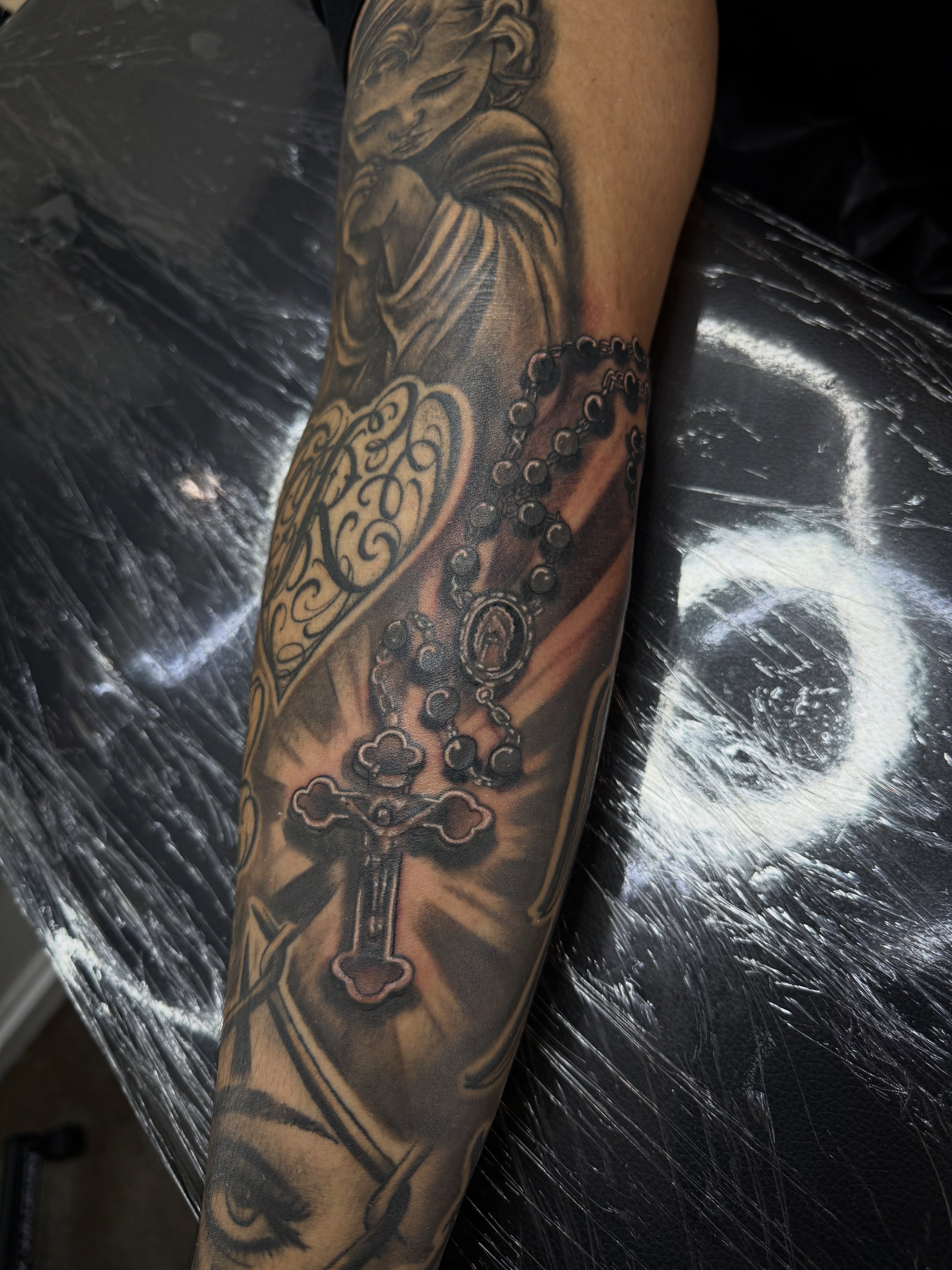 Religious iconography realism tattoo on the forearm by @samg_tat2s, San Diego, California