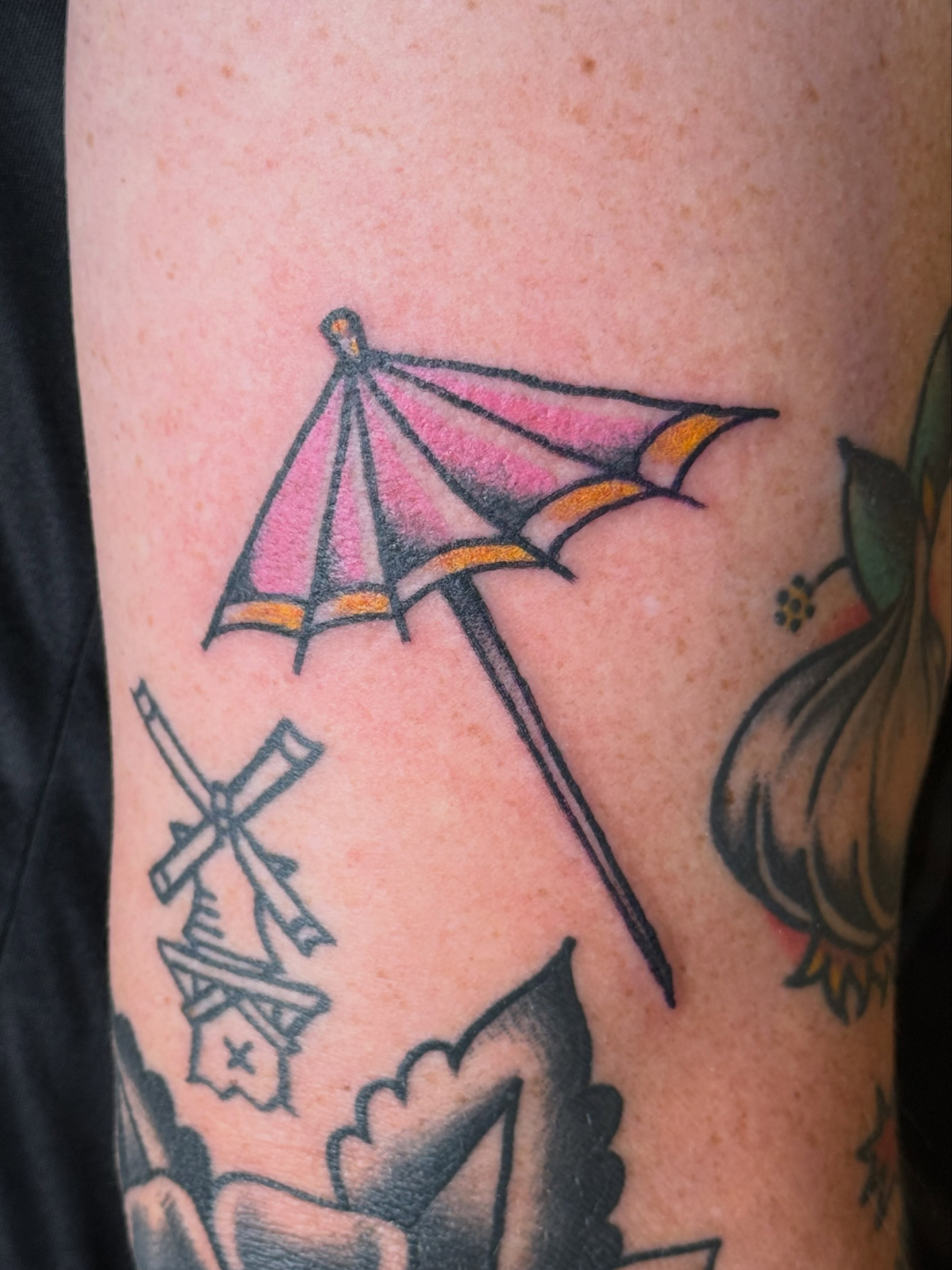 Beach umbrella American traditional tattoo on the forearm by Eric Guntor, Philadelphia, Pennsylvania