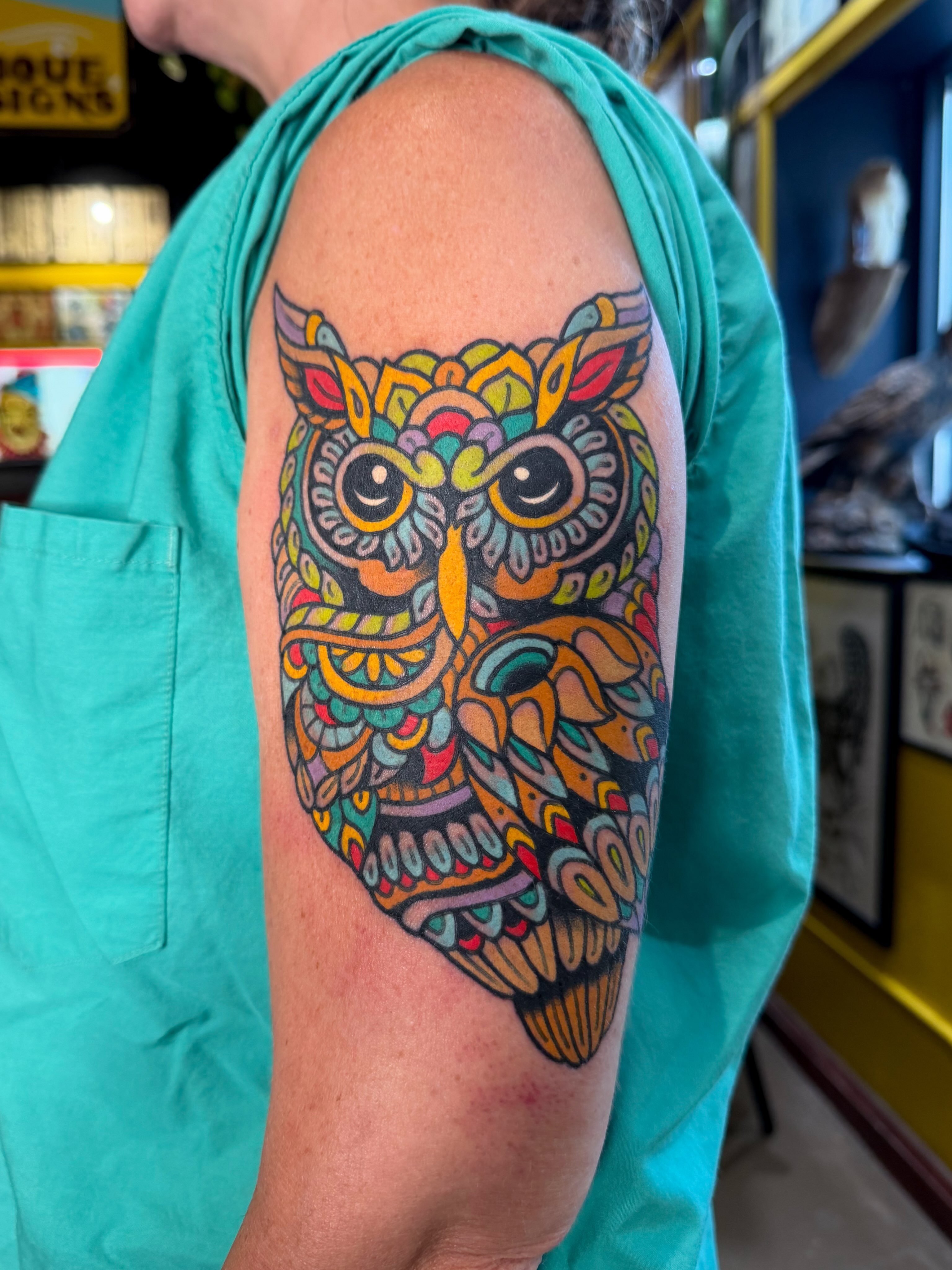 Owl geometric tattoo on the upper arm by Danny Reed, Asheville, North Carolina