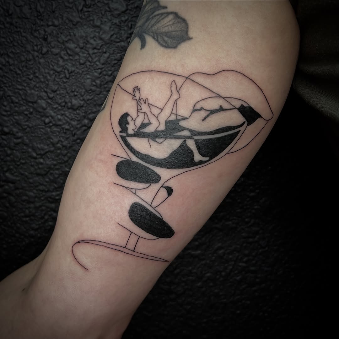 Person in a glass surrealism tattoo on the forearm by Elleree (LRE)