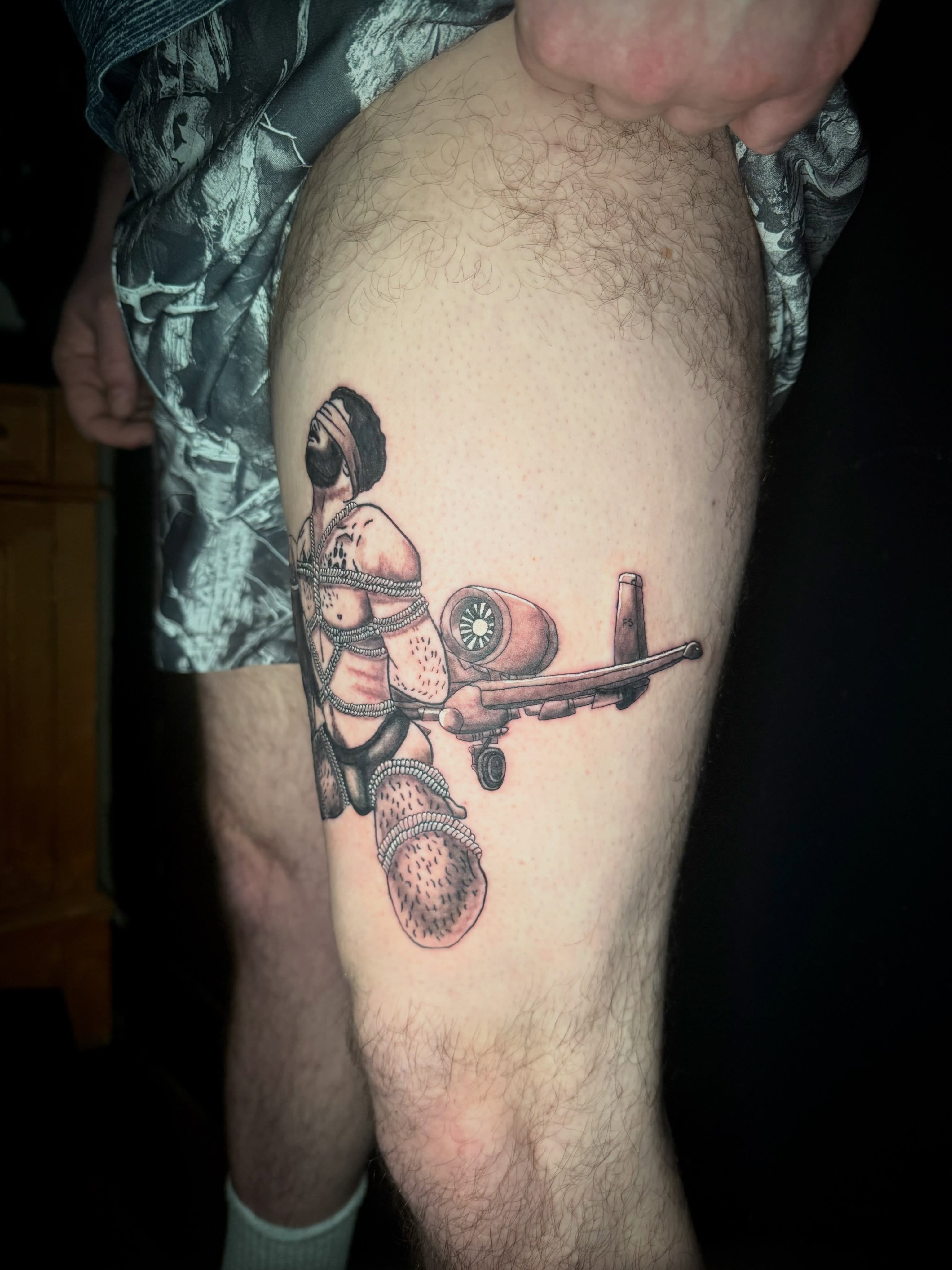 Gunner with machine gun realism tattoo on the thigh by Mikey
