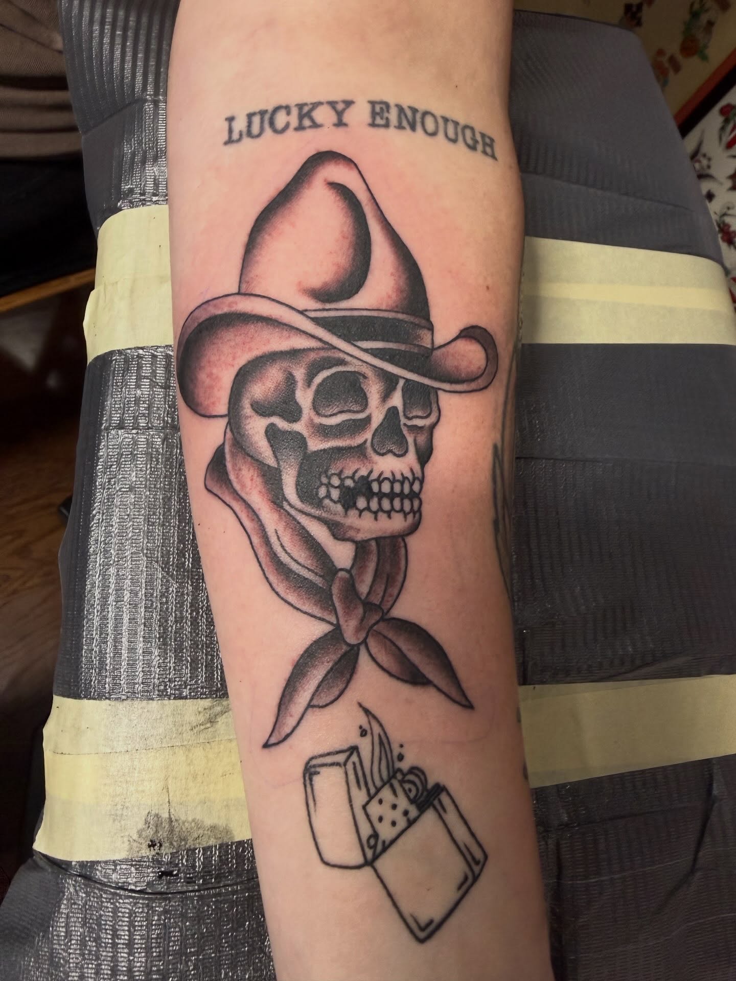 Cowboy skull with bandana realism tattoo on the forearm by Cody Dalton