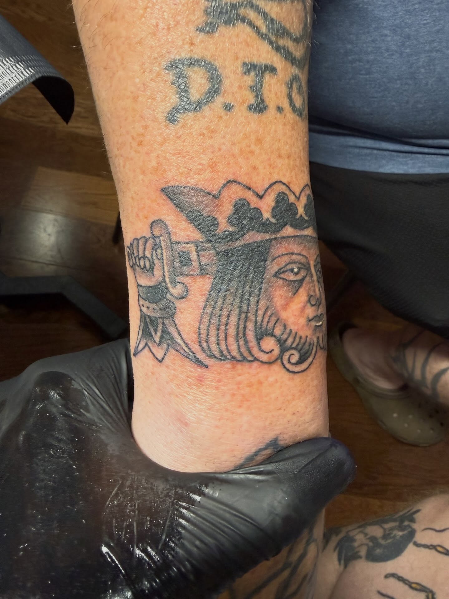 Woman's face American traditional tattoo on the forearm by Cody Dalton