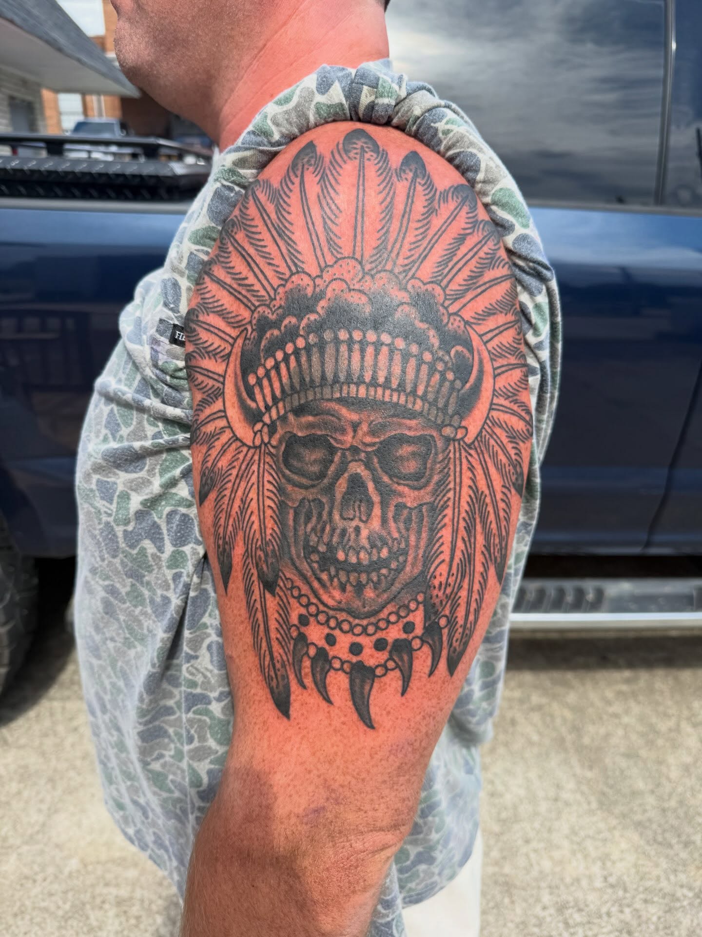 Skull with headdress American traditional tattoo on the forearm by Cody Dalton