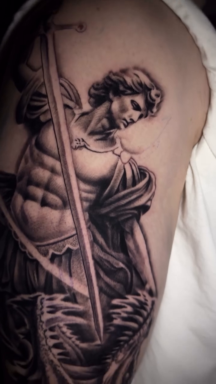 Greek statue with sword realism tattoo by Tony Garcia