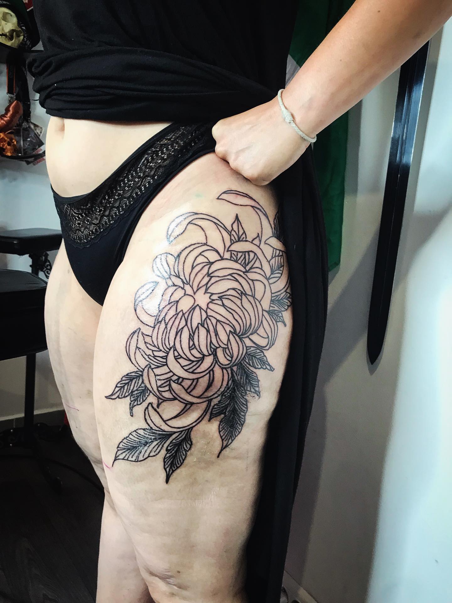 Floral bouquet black and grey tattoo on the thigh by Moss Quito Tattoo