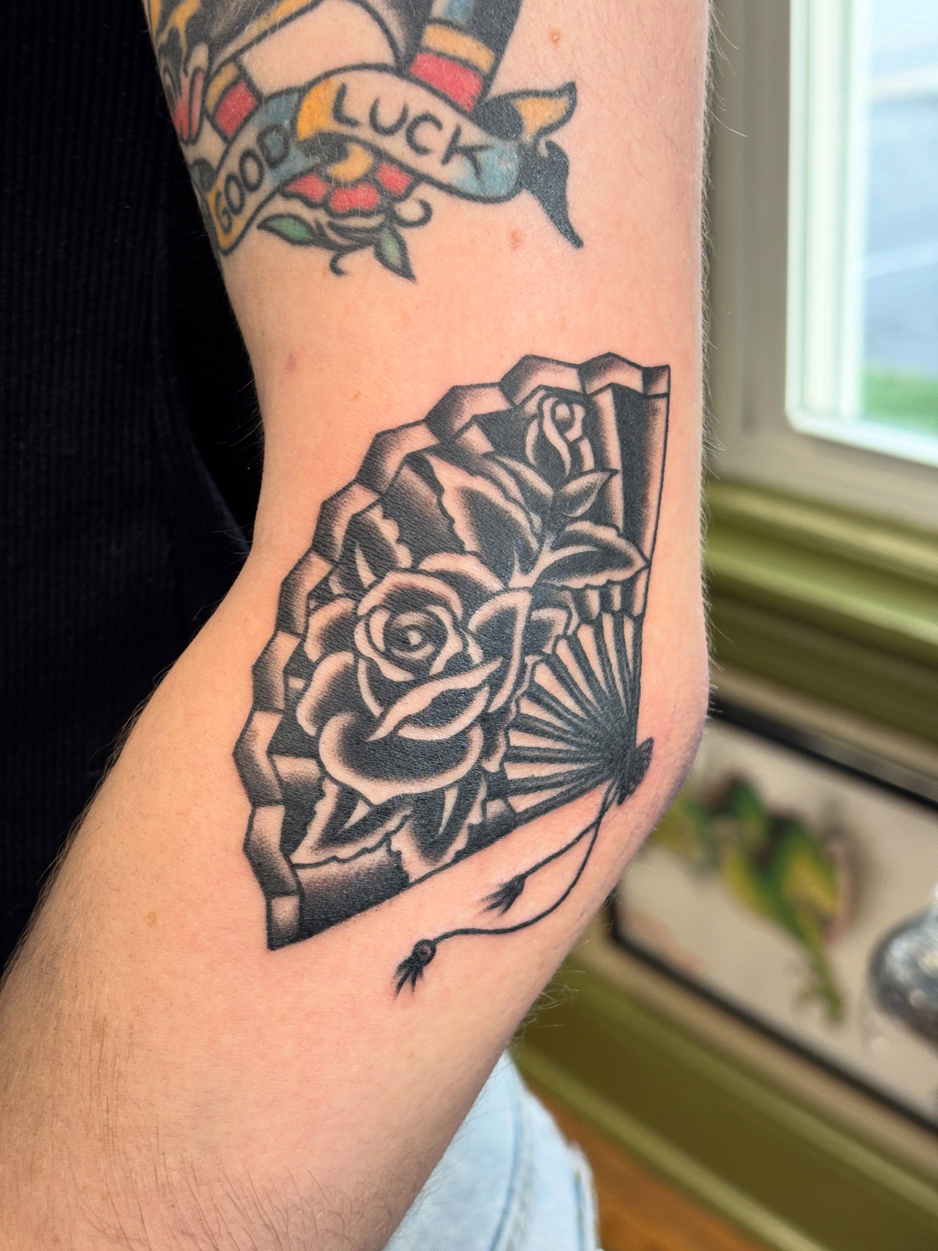 Rose American traditional tattoo on the forearm by Mike DiCicco