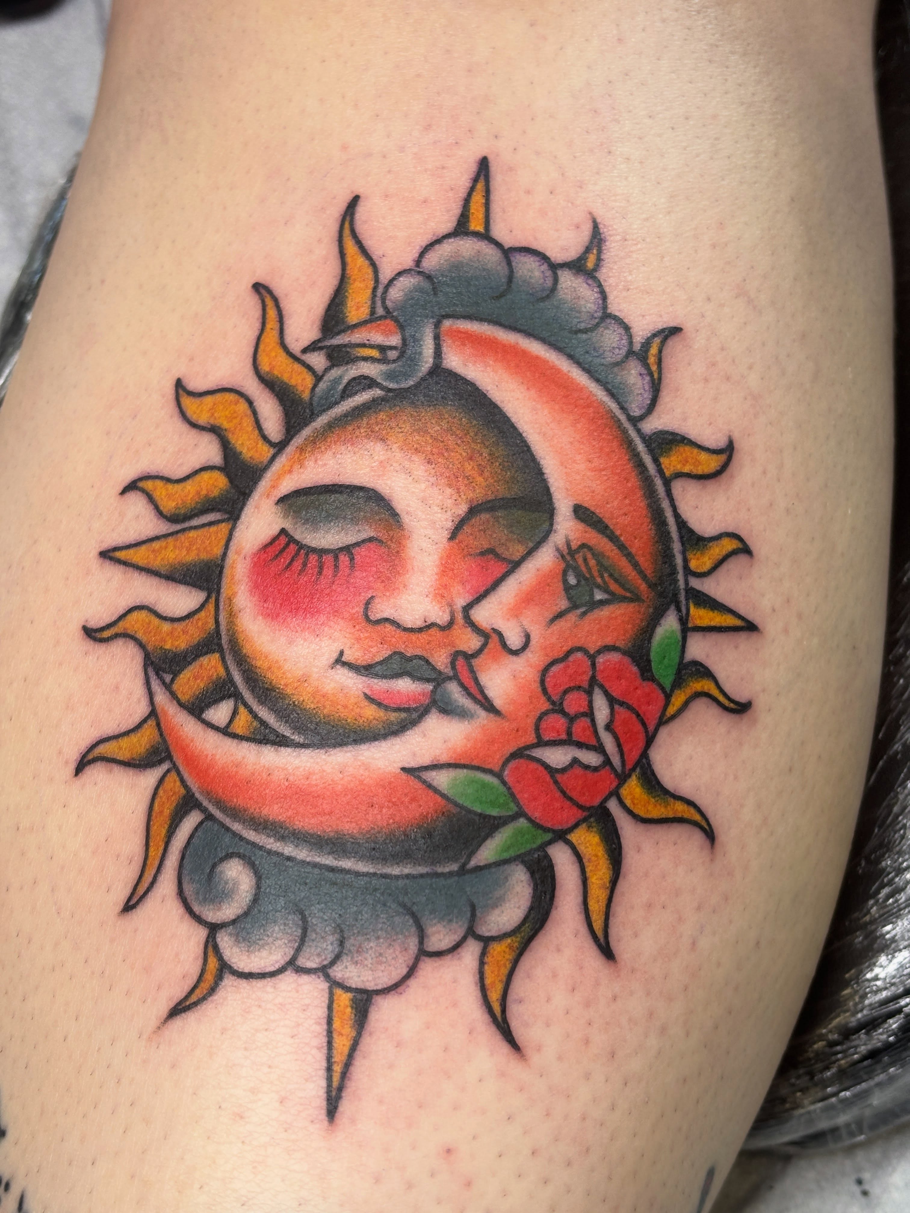 Sun and moon American traditional tattoo on the thigh by Mike DiCicco