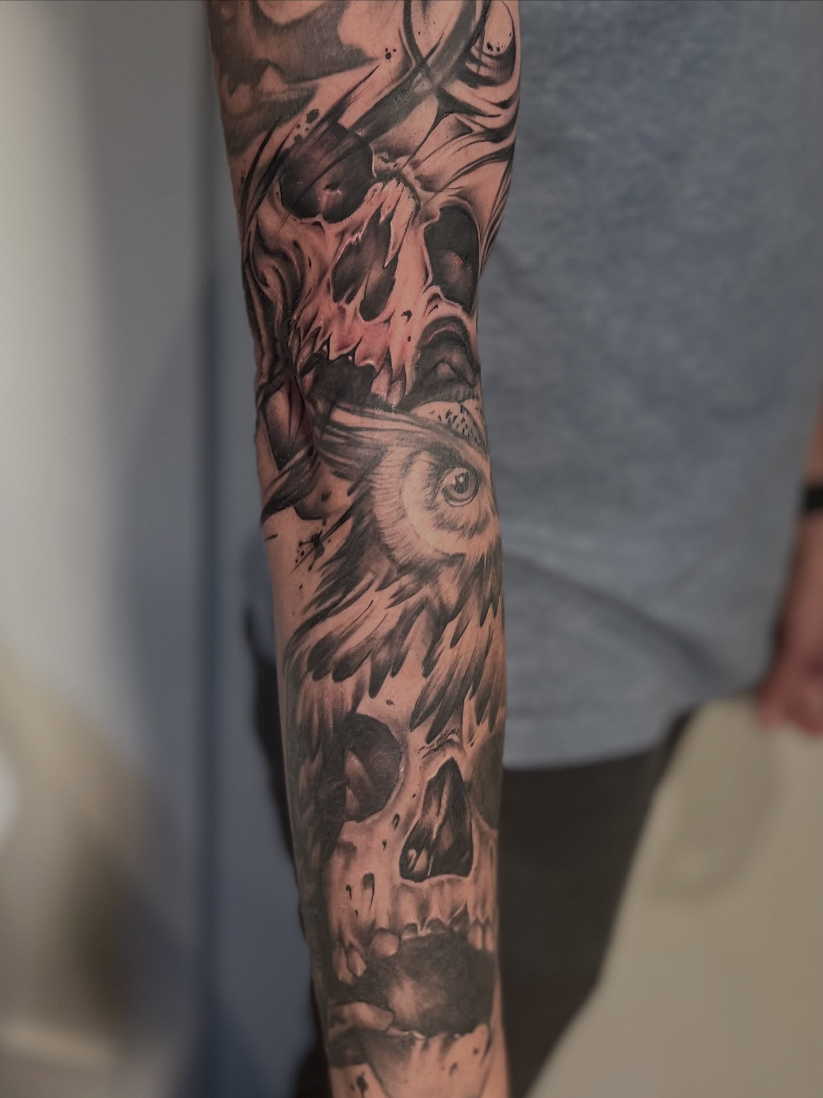 Owl and skull realism tattoo on the forearm by Matthew Crawley