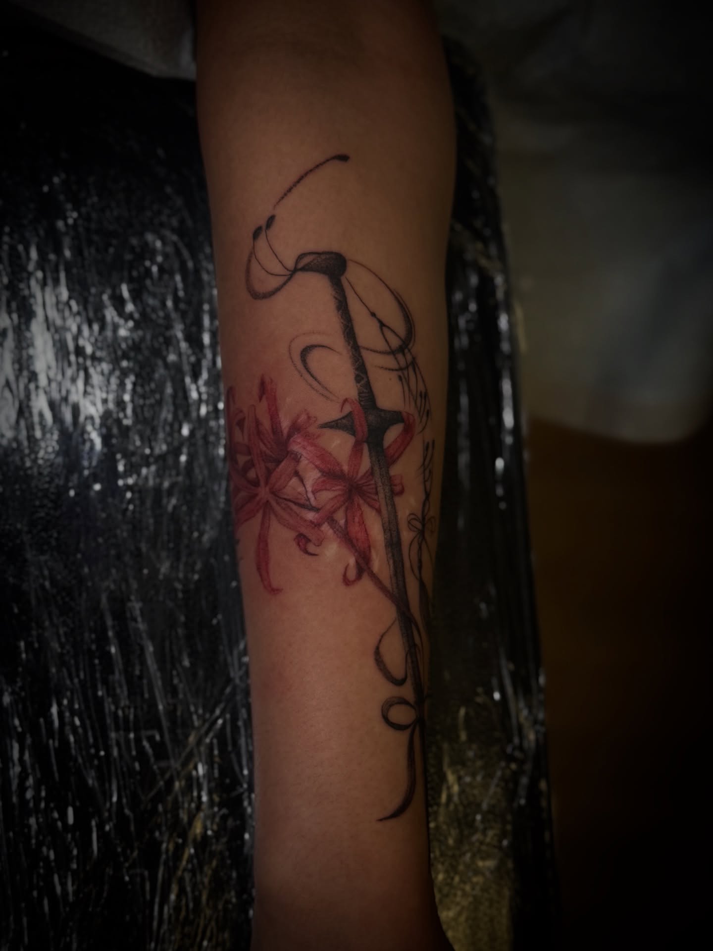 Sword and flowers new school tattoo on the forearm by Gianna G