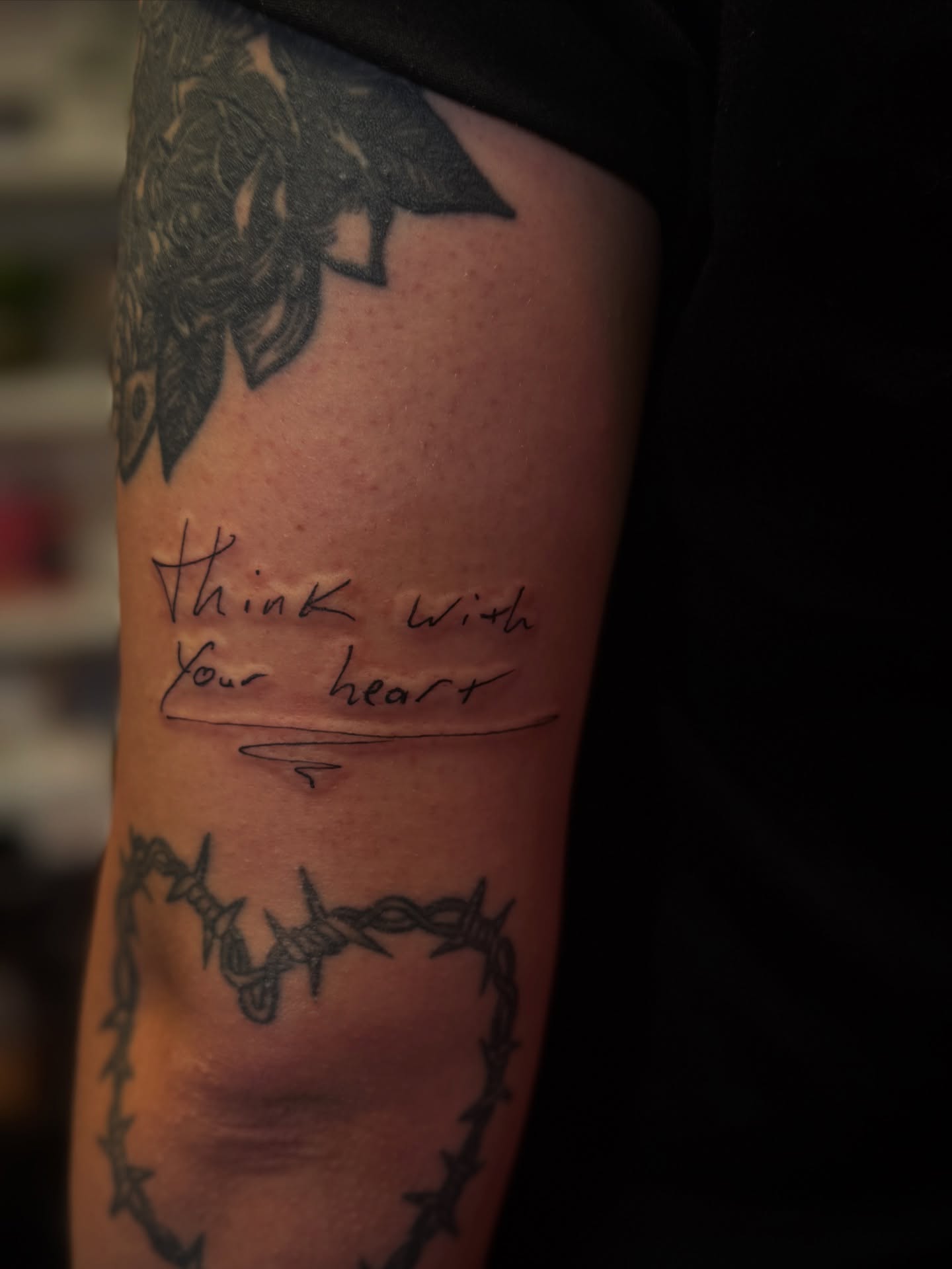 Think with your heart black and grey tattoo on the forearm by Gianna G