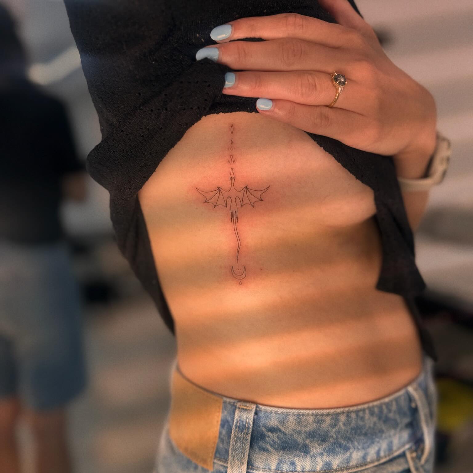 Bat fine line tattoo on the ribs by Ellie