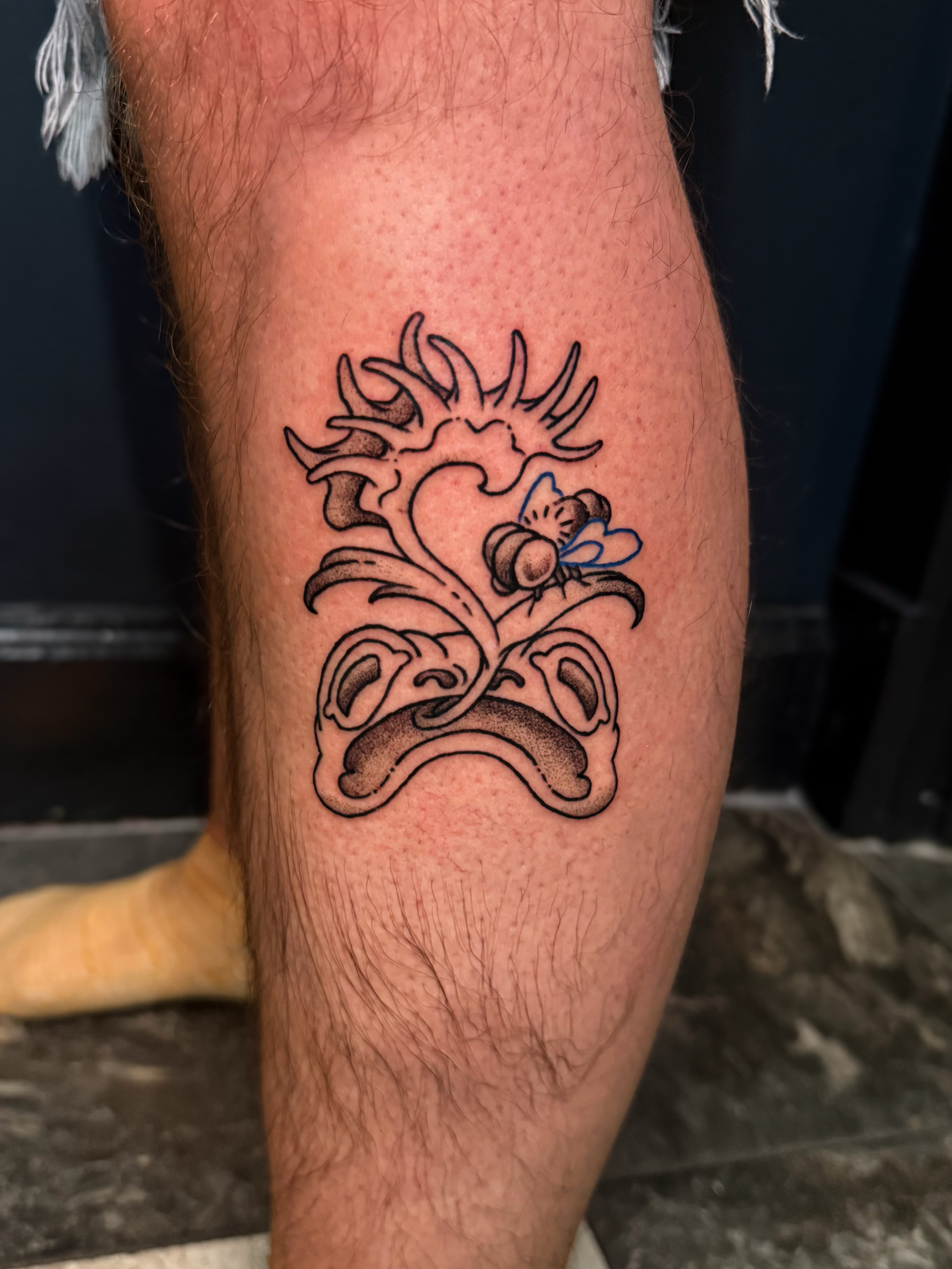 Heart with floral elements neo-traditional tattoo on the calf by Ivy-Jade Edwards, Memphis, Tennessee