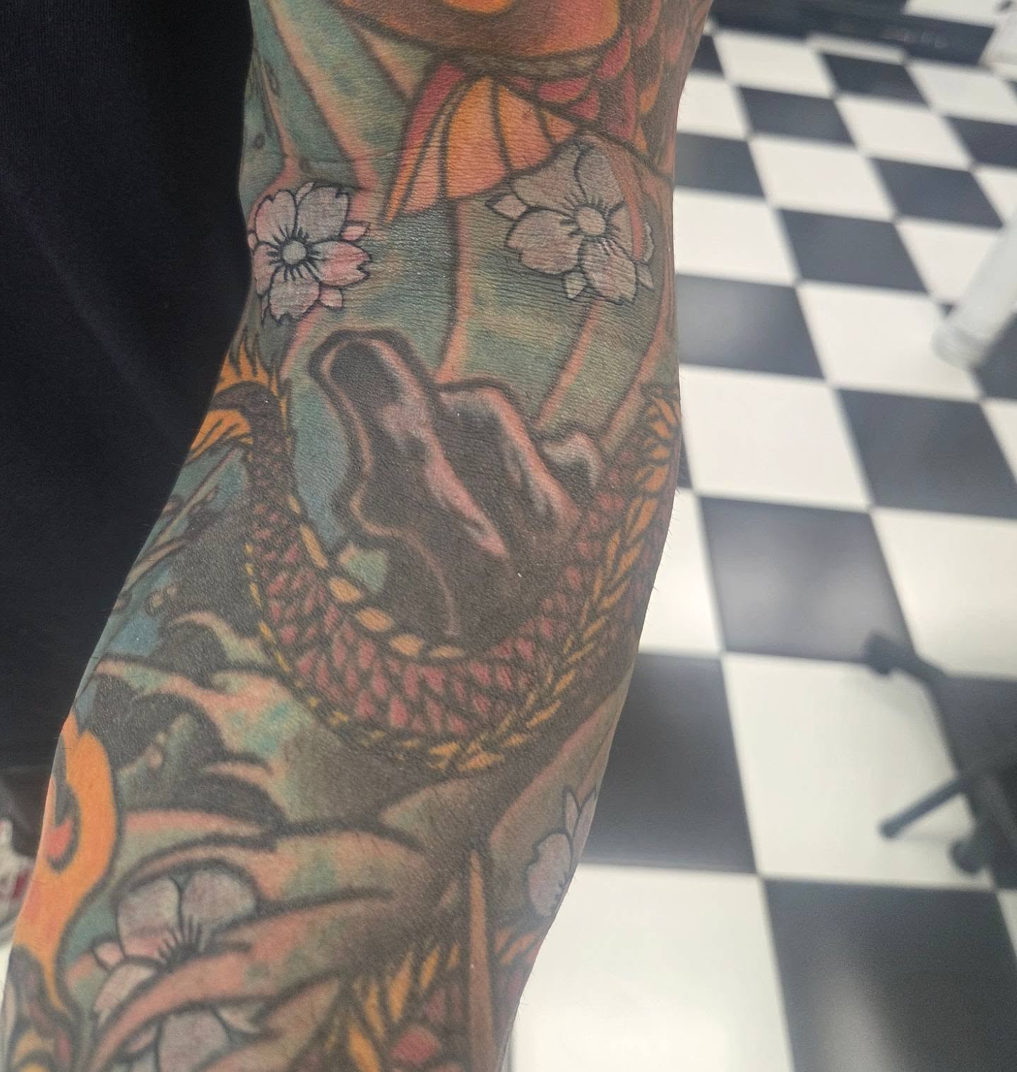 Dragon and cherry blossoms American traditional tattoo on the forearm by Molly DeSmedt