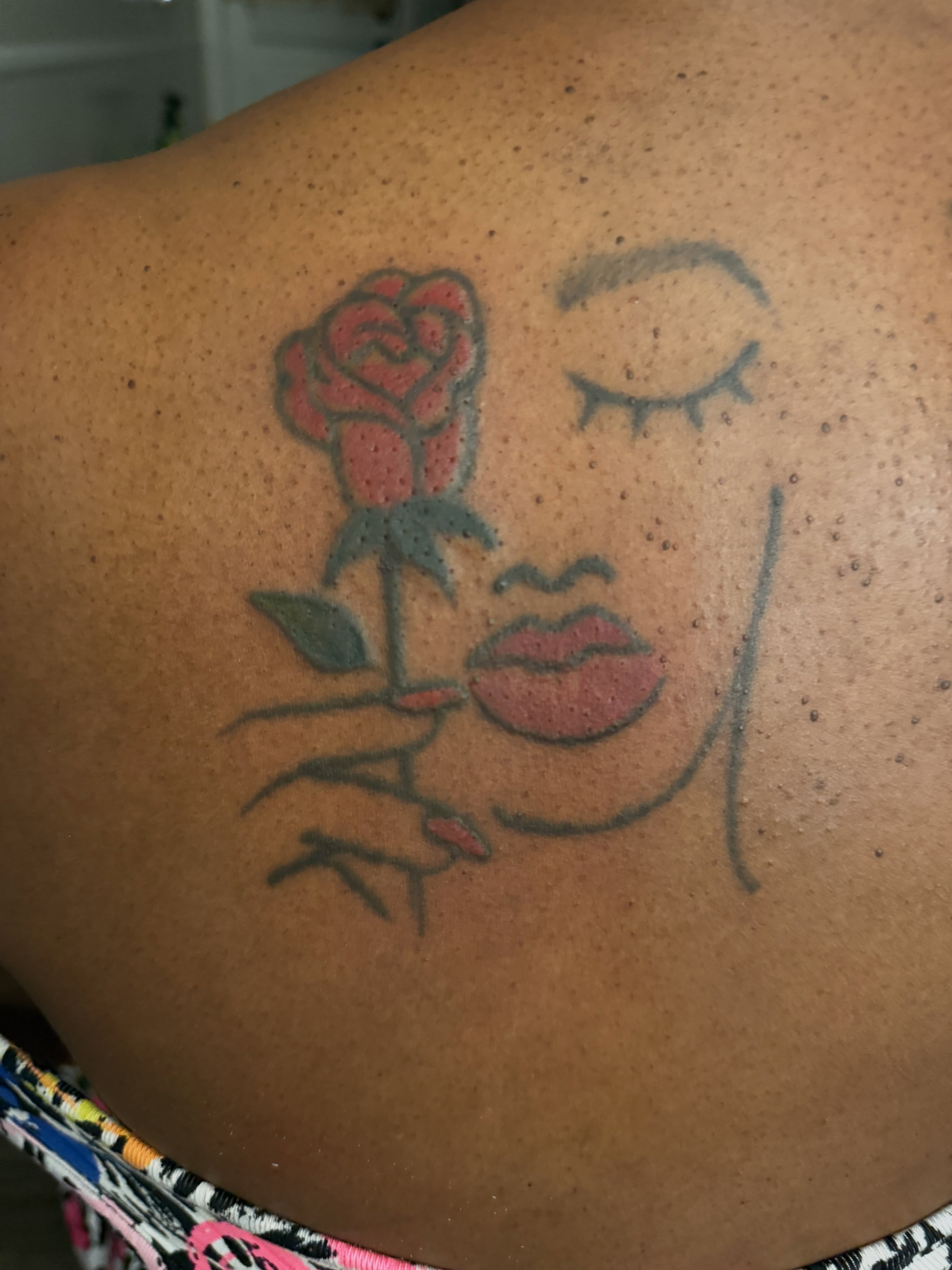Rose and lips American traditional tattoo on the back by Aja Marie