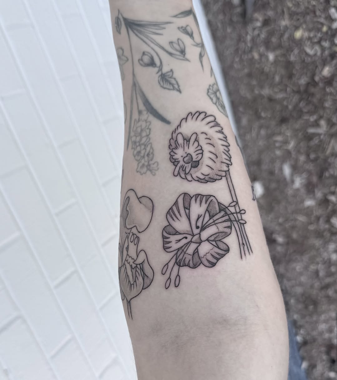 Flowers black and grey tattoo on the forearm by Audrey Kacel, Holland, Michigan