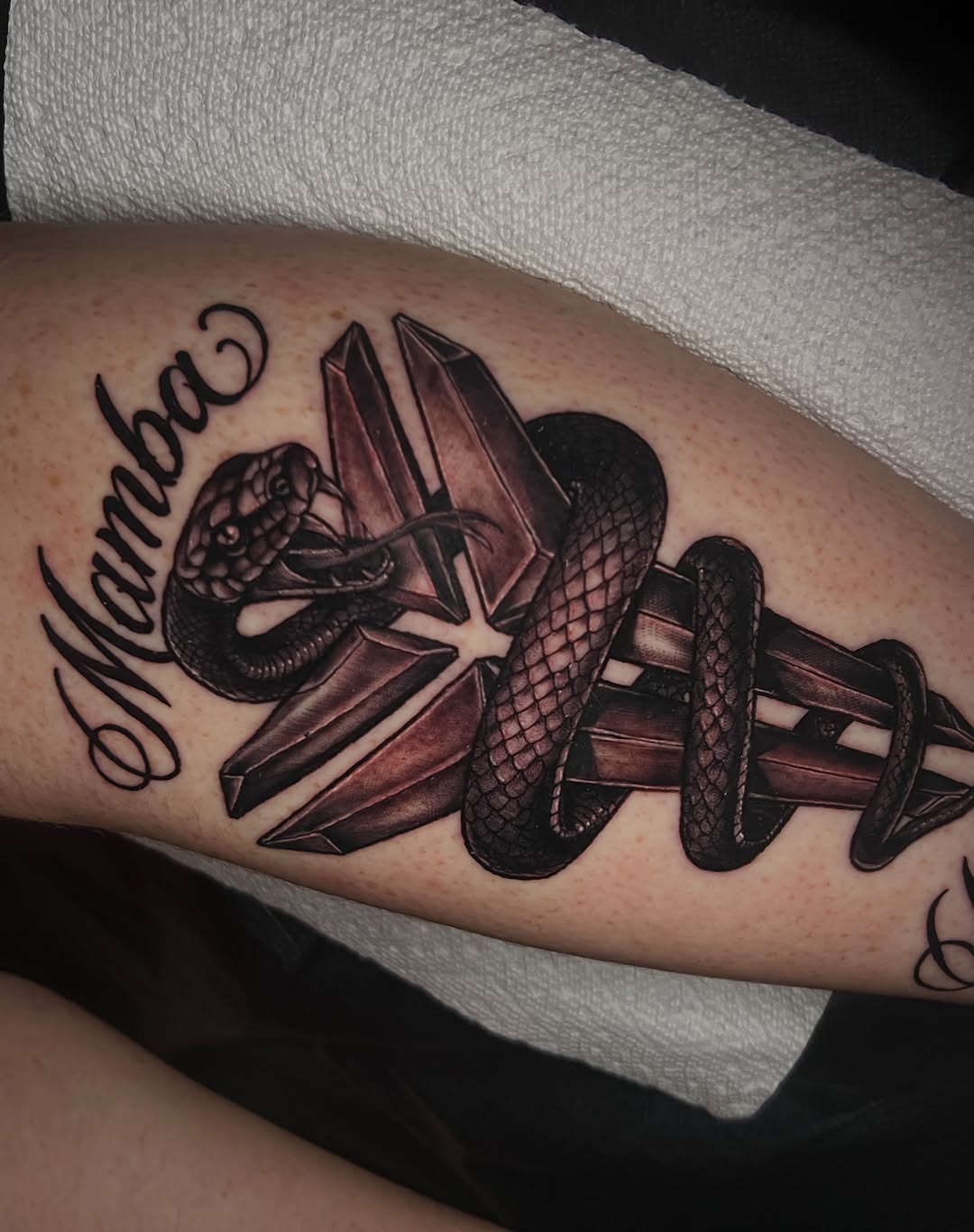 Tattoo by @redinkdtattoos — realism, lettering_script