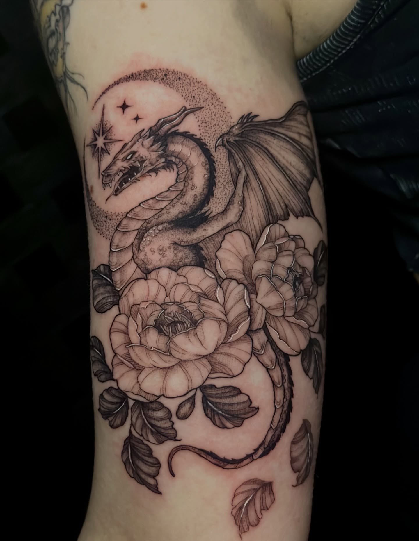 Dragon and roses dotwork tattoo on the forearm by Sabrina, Harrison, New Jersey